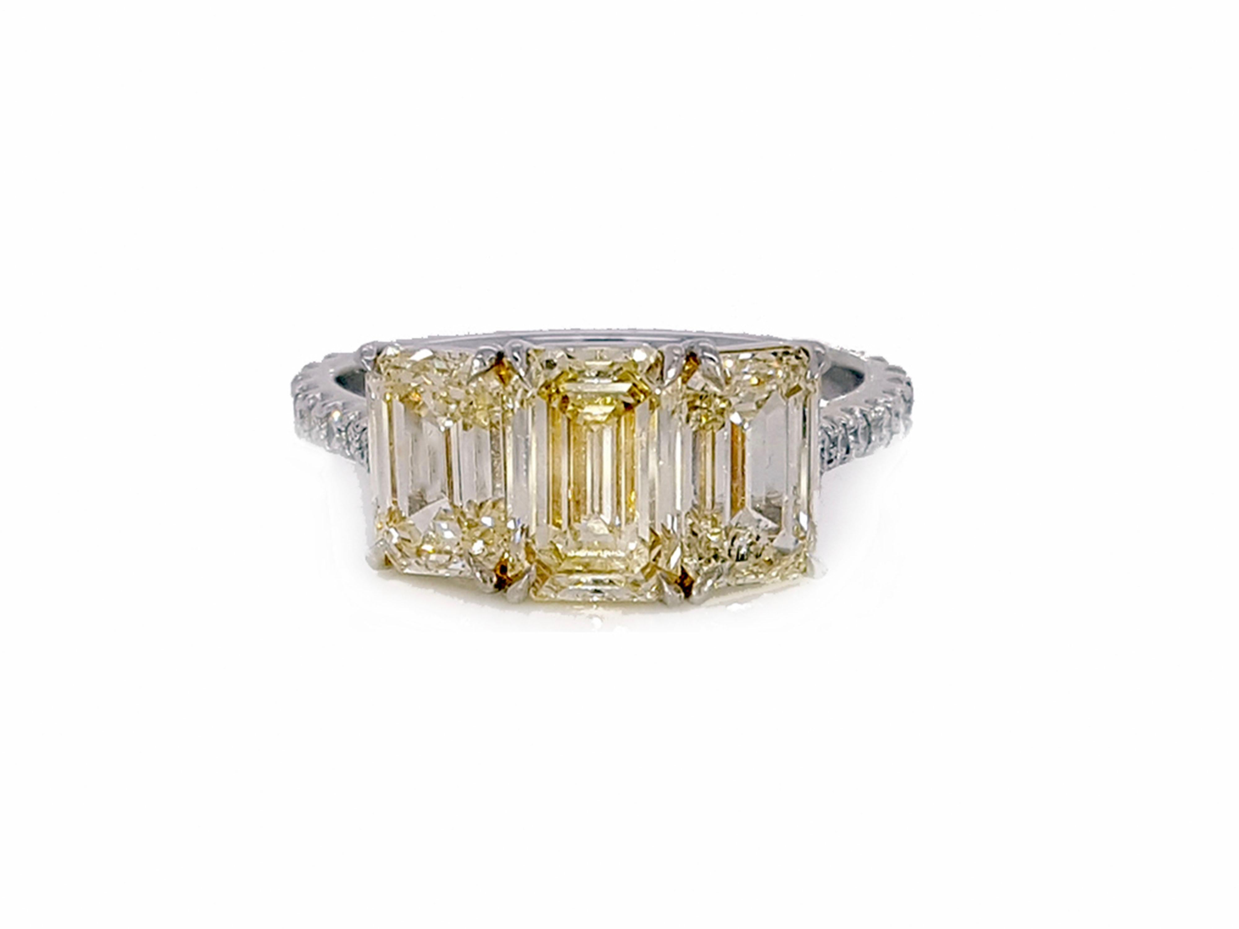 3.35 Carat Yellow Diamond Emerald Cut Three-Stone Engagement Ring, Platinum. In New Condition For Sale In New York, NY