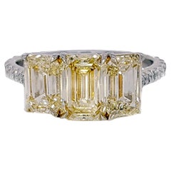 3.35 Carat Yellow Diamond Emerald Cut Three-Stone Engagement Ring, Platinum.