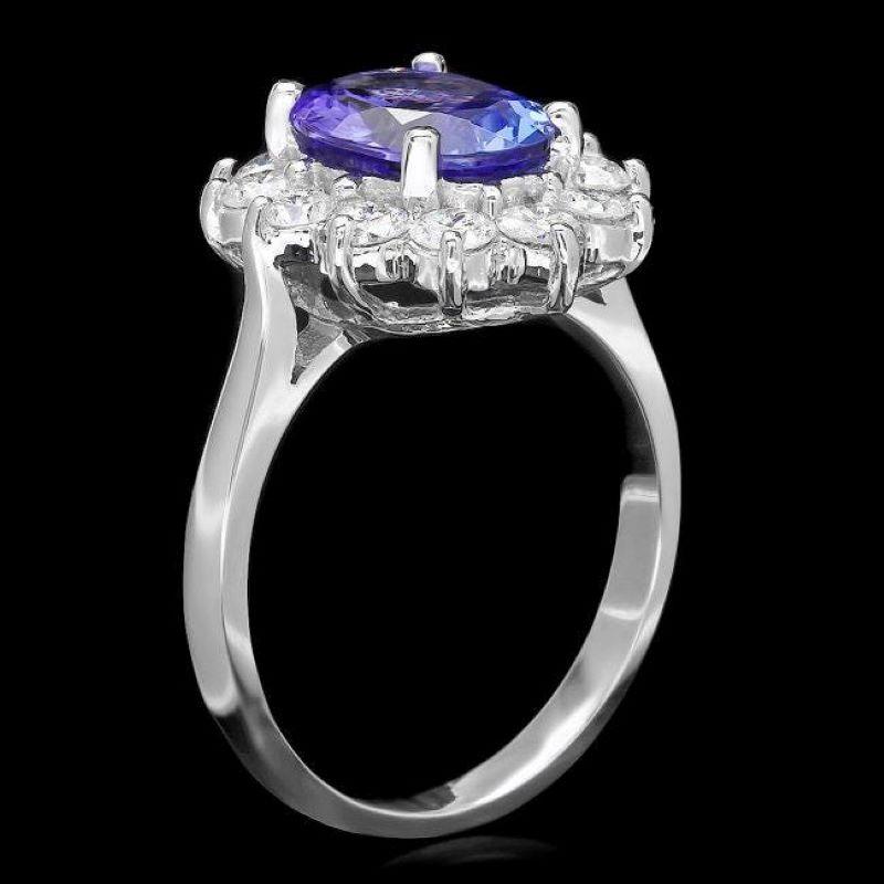 3.35 Carats Natural Very Nice Looking Tanzanite and Diamond 14K Solid White Gold Ring

Total Natural Oval Cut Tanzanite Weight is: Approx. 2.50 Carats 

Tanzanite Measures: Approx. 10.00 x 8.00mm

Natural Round Diamonds Weight: Approx. 0.85 Carats