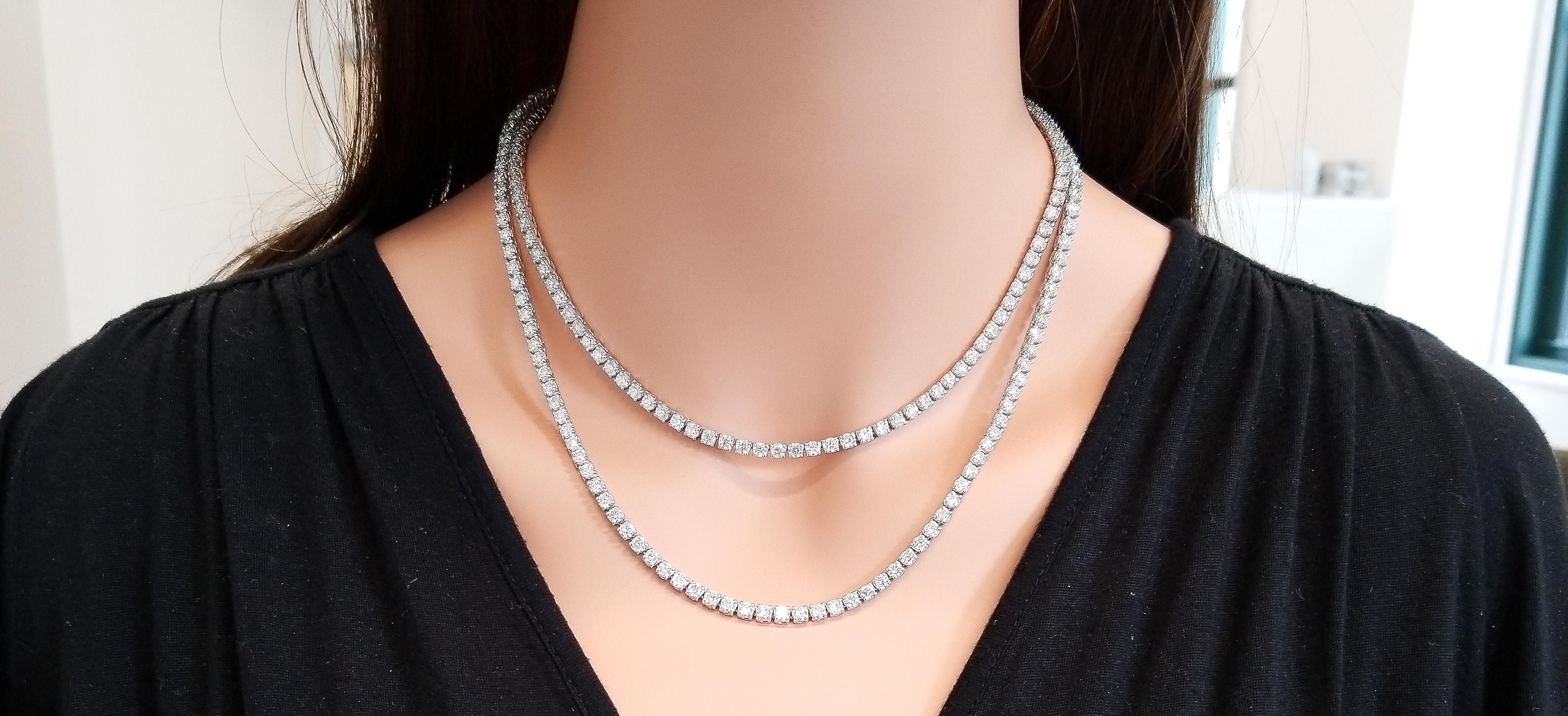 This is a tennis necklace that deserves attention. It's long, chic, and timeless. Show-stopping in fire and brilliance, this incredible tennis necklace features 223 sparkling round brilliant cut diamonds that are skillfully prong set from end to end
