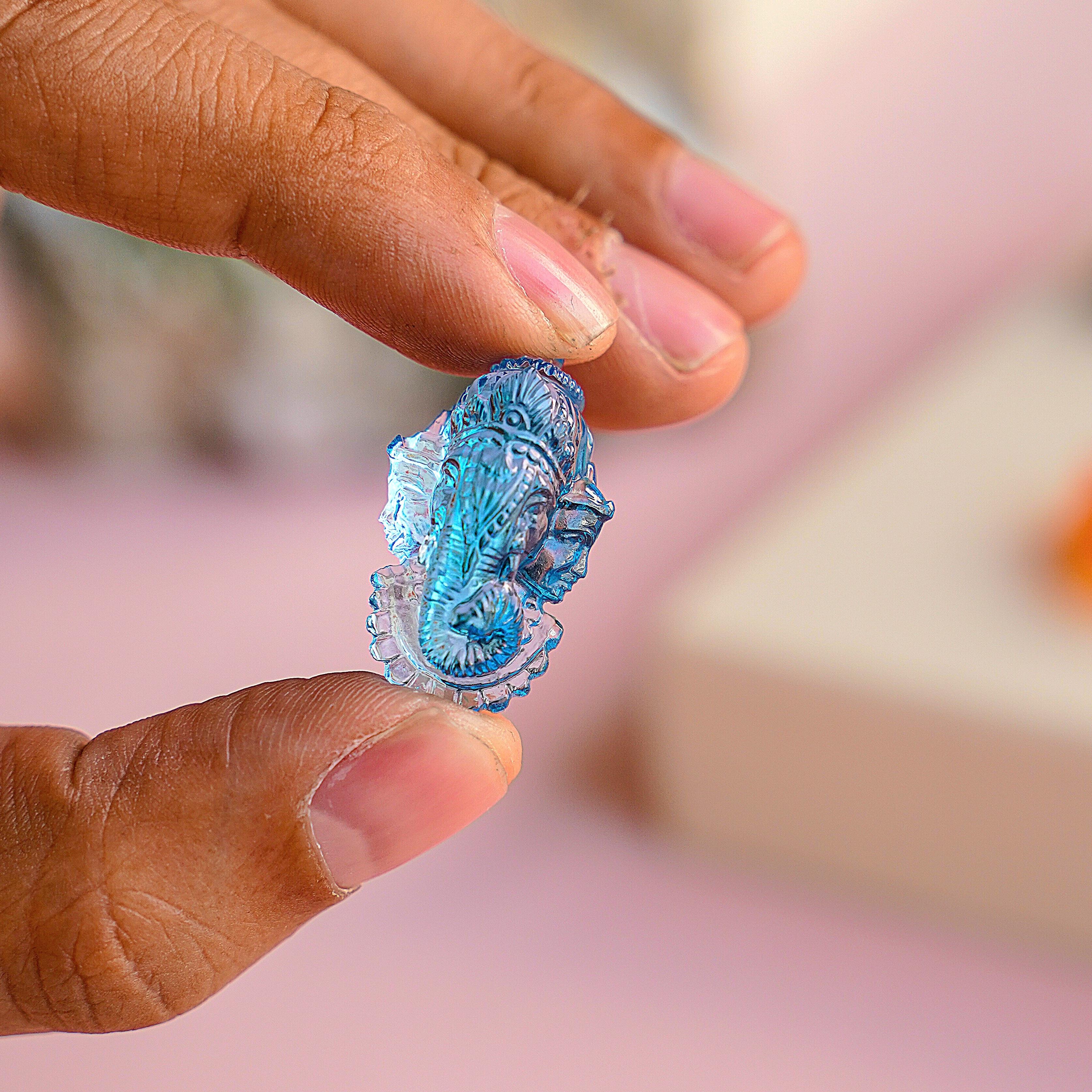 Our hand-carved 33.54 carat Swiss Blue Topaz Ganesha Riddhi Siddhi Carving Loose Gemstone is a magnificent work of art created with meticulous attention to detail by our expert lapidary artist in Jaipur. This extraordinary piece showcases the