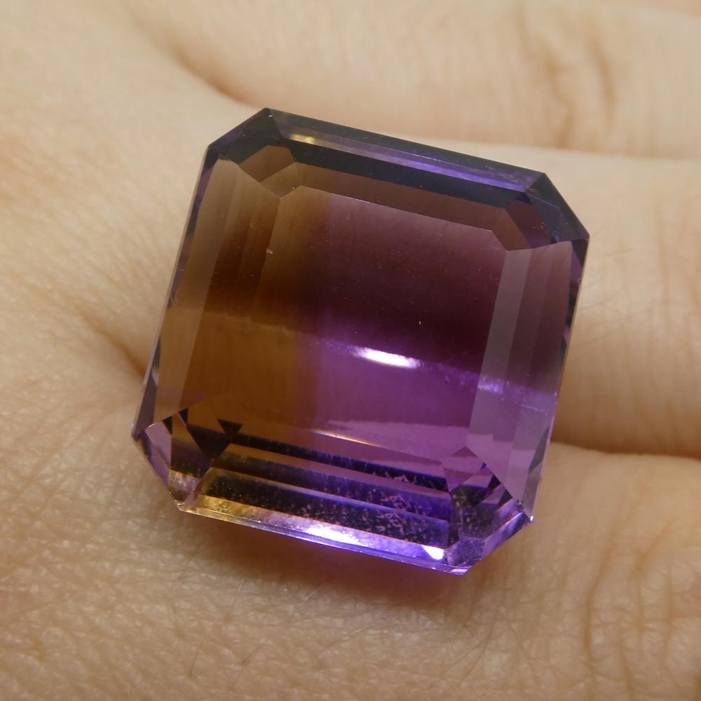 Description:

Gem Type: Ametrine
Number of Stones: 1
Weight: 33.59 cts
Measurements: 18x17.50x12.50 mm
Shape: Square
Cutting Style Crown: Step Cut
Cutting Style Pavilion: Step Cut
Transparency: Transparent
Clarity: Very Slightly Included: Eye Clean