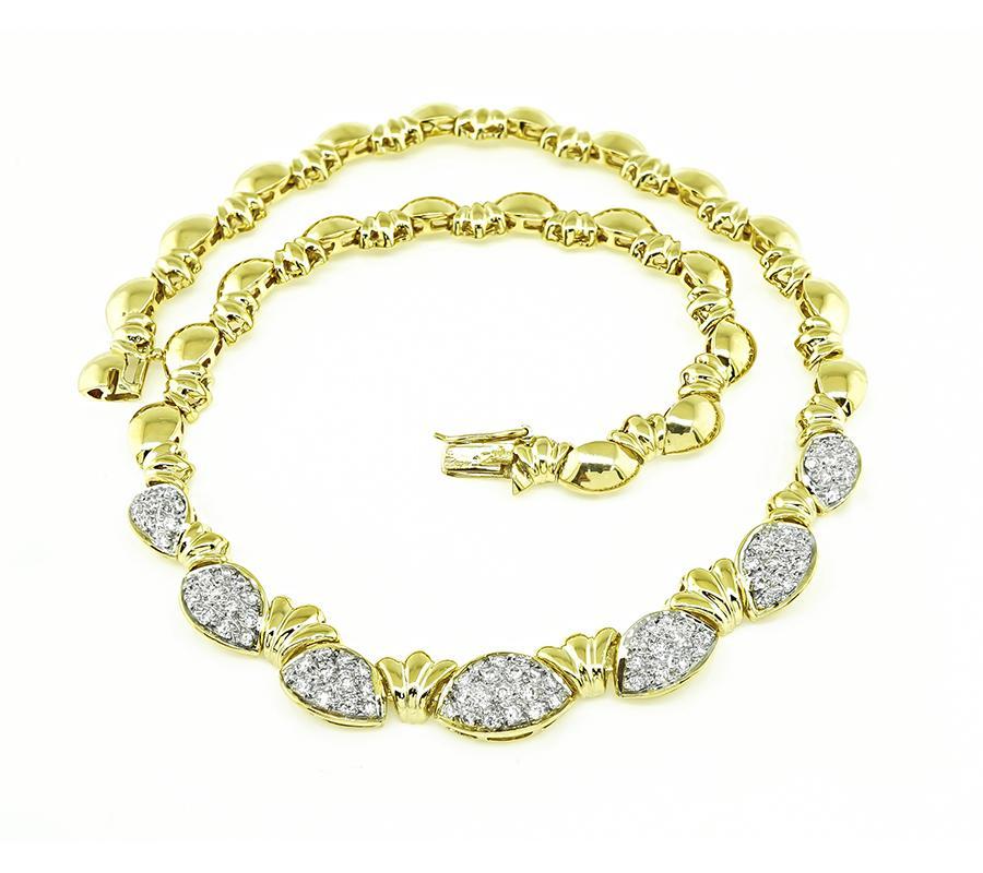 This is a stunning 18k yellow and white gold necklace. The necklace is set with sparkling round cut diamonds that weigh approximately 3.35ct. The color of these diamonds is F-G with VS clarity. The necklace measures 14 1/4 inches in length and
