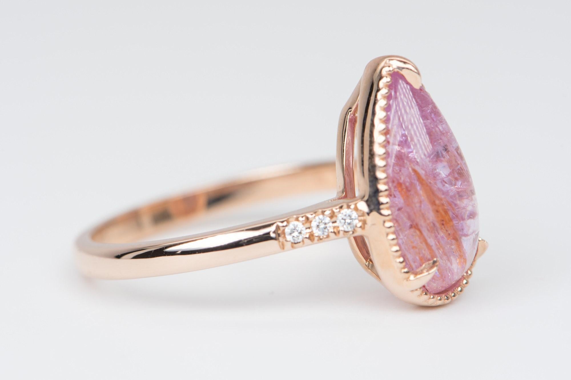 â™¥ A solid 14k rose gold ring set with an elongated pear shaped pink imperial topaz stone in the center, with trio diamond accent on each side
â™¥ The overall setting measures 8.4mm in width, 14.4mm in length, and sits 7mm tall from the