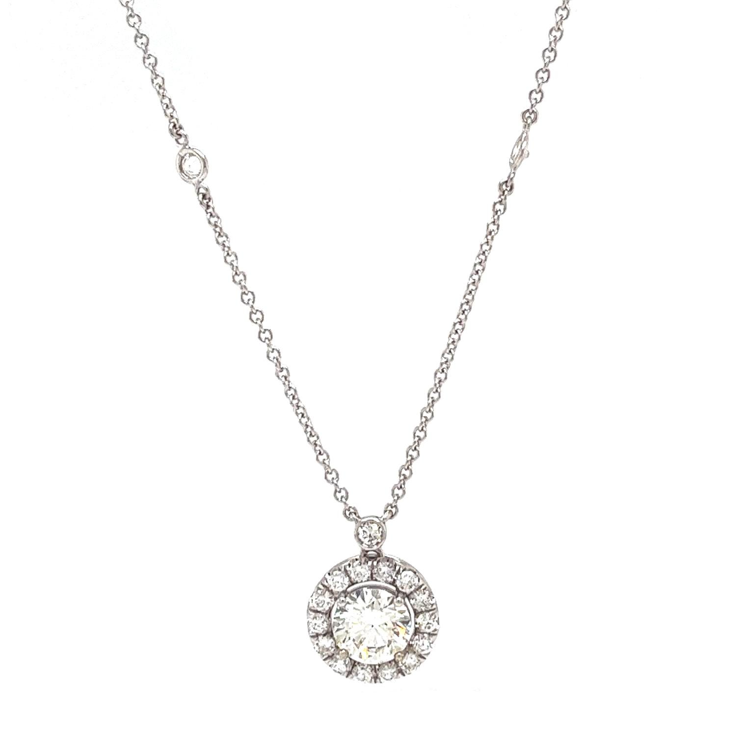 This magnificent necklace has a stunning natural round halo diamond pendant in 14K white gold. It has VS1 Clarity and J Colour, totaling 1.77 Carat. This ring also has round pave diamonds with VS1 Clarity and H Colour, providing delicate beauty and