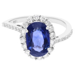 3.36 Carat Oval Blue Sapphire Diamond Halo Cocktail Ring 18 Karat White Gold