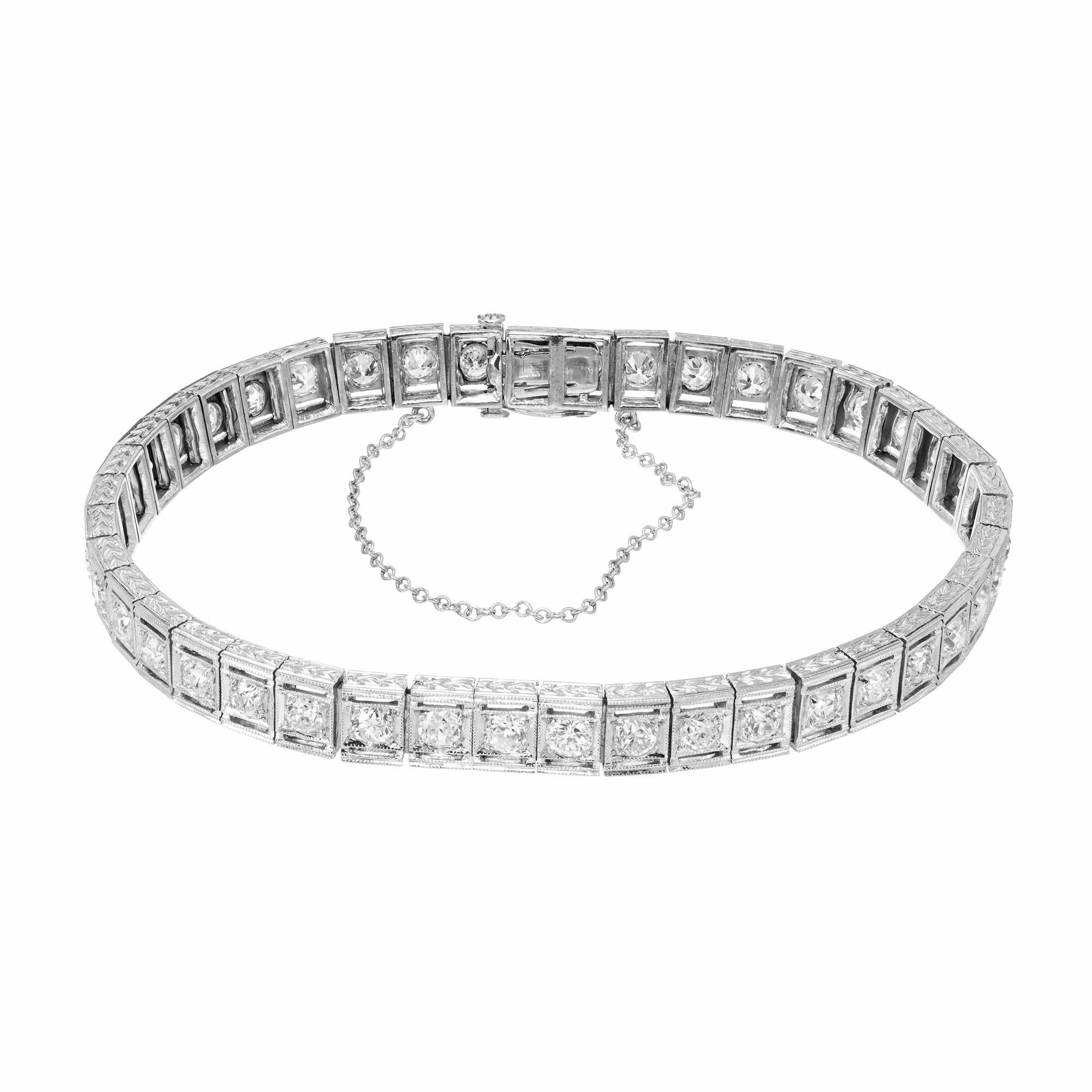Diamond tennis bracelet. 42 round cut diamonds totaling 3.36cts that are set in platinum engraved squares. The diamonds have nice brilliance and are mounted solidly into each square that are linked together frame by frame. The catch is secure and is
