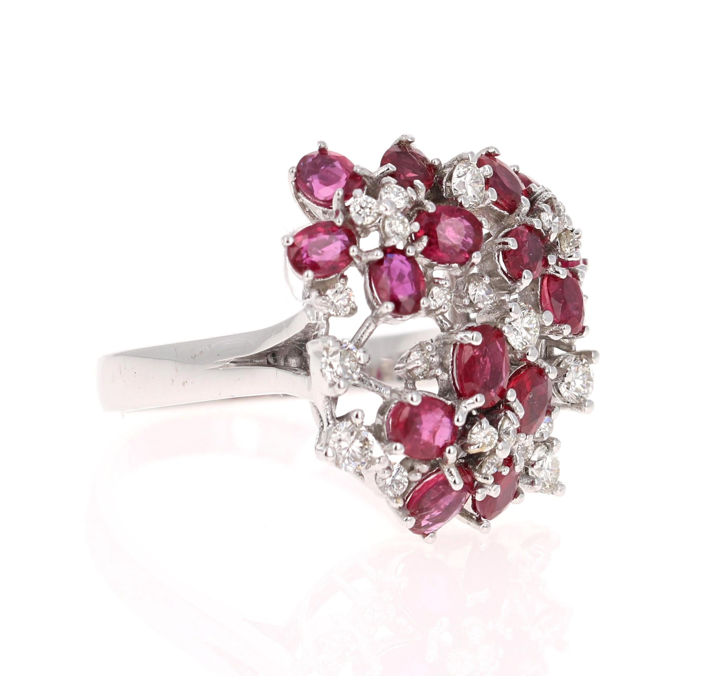 A Statement Ruby & Diamond Ring! 
This ring has multiple Oval Cut Natural Red Rubies weighing 2.72 Carats and 25 Round Cut Diamonds embellished around weighing 0.64 Carats. The clarity and color of the diamonds are SI1-F. 

The ring is beautifully