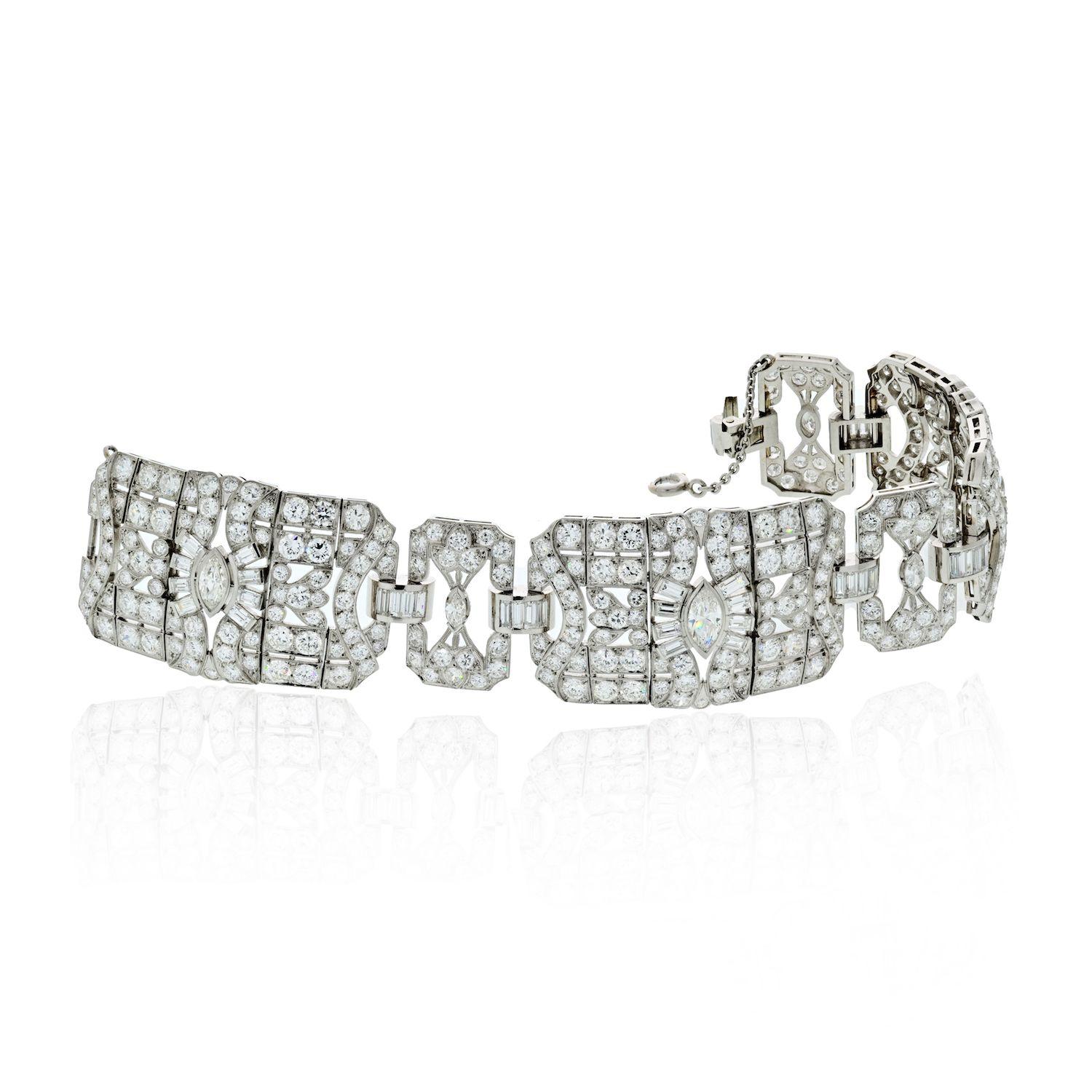 An incredible Art Deco bracelet features 30 carats of marquise, baguette, and single cut diamonds set in platinum for a detailed and artistic look. The marquise shaped diamonds anchor the piece with large open spaces and baguette-cut diamonds are