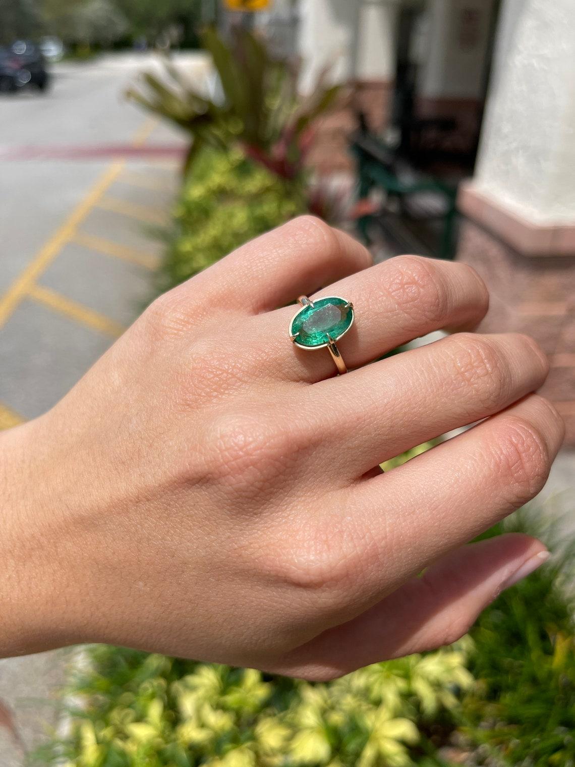oval emerald solitaire ring