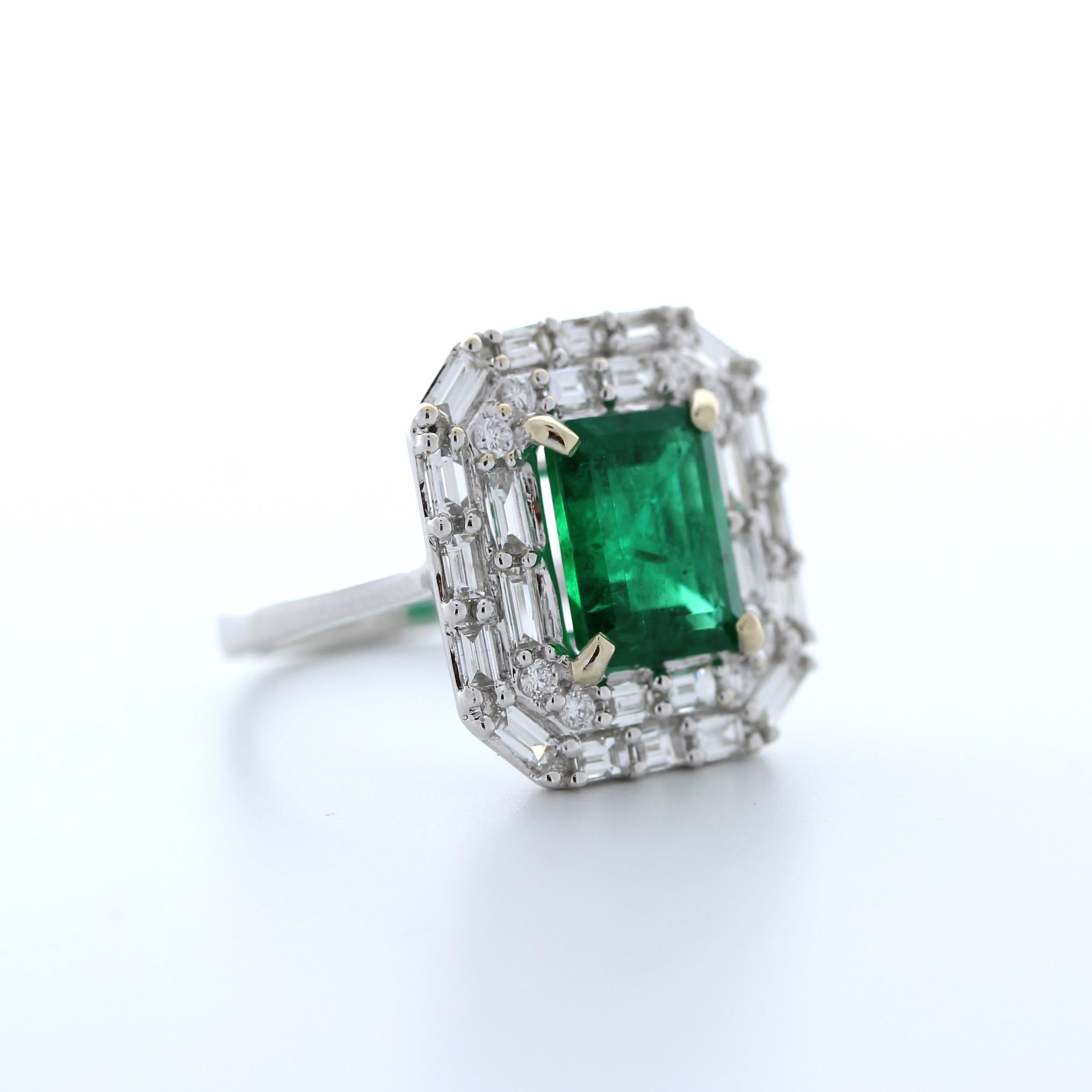 This breathtaking 3.37 carat weight green emerald fashion ring is truly a statement piece. Set in luxurious 18K white gold, the vivid green emerald commands attention with its intense color and exceptional clarity. The emerald is complemented by 32