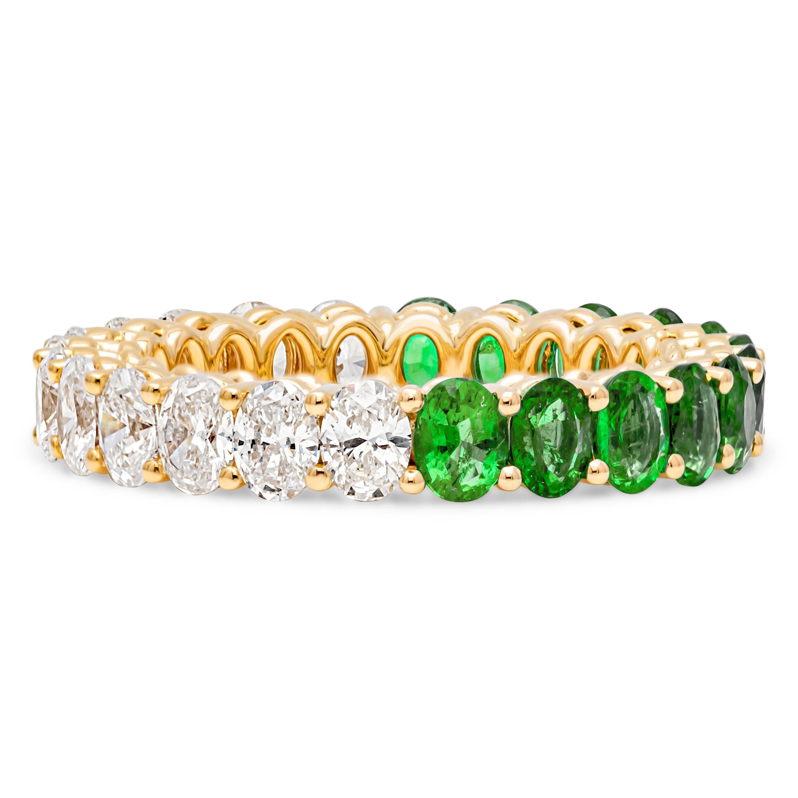 A beautiful and vibrant eternity wedding band style showcasing a color-rich 12 oval cut green emerald weighing 1.69 carats total and 10 brilliant oval cut diamonds weighing 1.68 carats total, set in a shared prong setting. Eternity set in an open