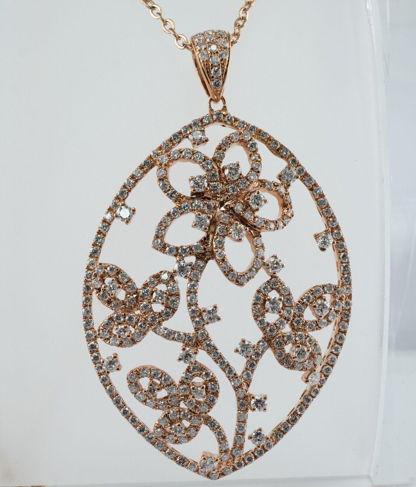 3.37 ctw Diamond Cluster Flower Pendant 14K Gold Hallmarked CJ

This estate pendant is crafted in solid 14K Yellow Gold with a hint of Rose gold.
It is studded with natural white round brilliant cut diamonds.
There are approximately 283 diamonds of