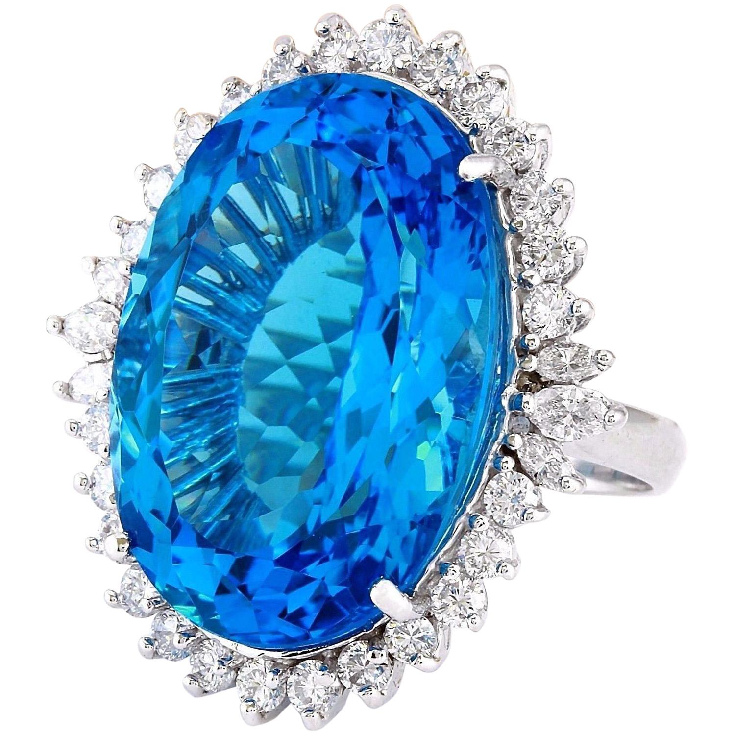 33.70 Carat Natural Topaz 14K Solid White Gold Diamond Ring
 Item Type: Ring
 Item Style: Cocktail
 Material: 14K White Gold
 Mainstone: Topaz
 Stone Color: Blue
 Stone Weight: 32.00 Carat
 Stone Shape: Oval
 Stone Quantity: 1
 Stone Dimensions: