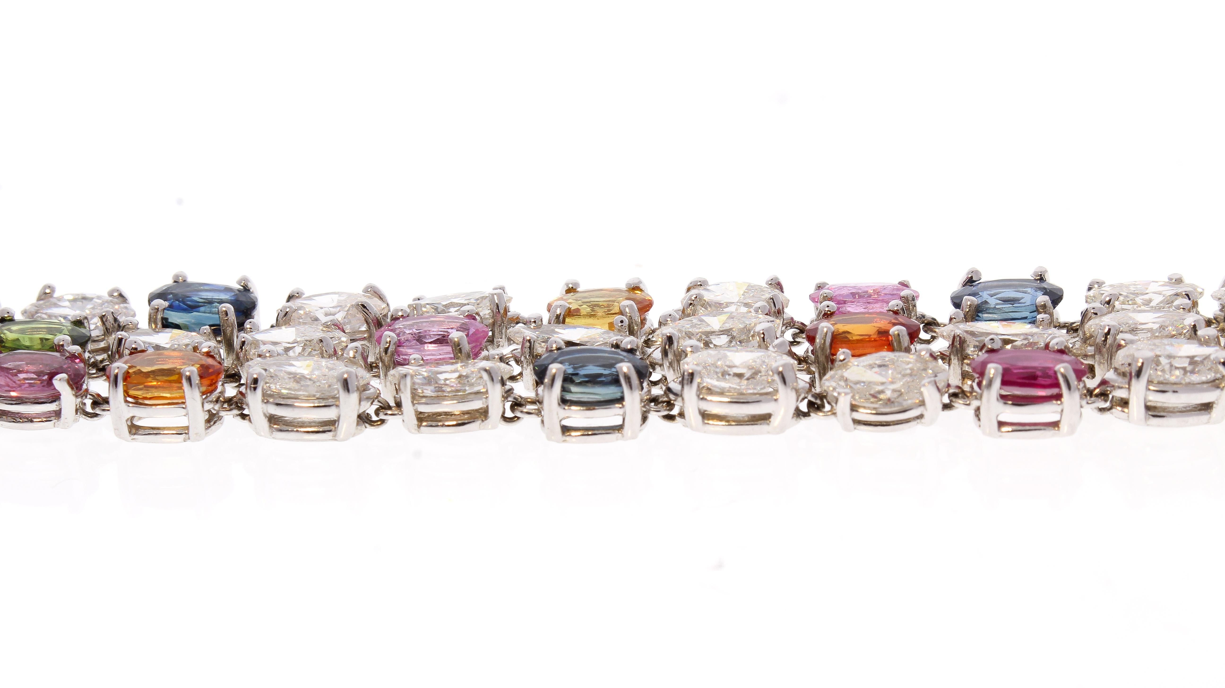 This gorgeous multicolored sapphire and diamond bracelet is luxury at it’s finest. It features a triple row of multicolored natural sapphires, sourced and collected from Sri Lanka, that total 17.0 carat accompanied by fiery marquise cut diamonds