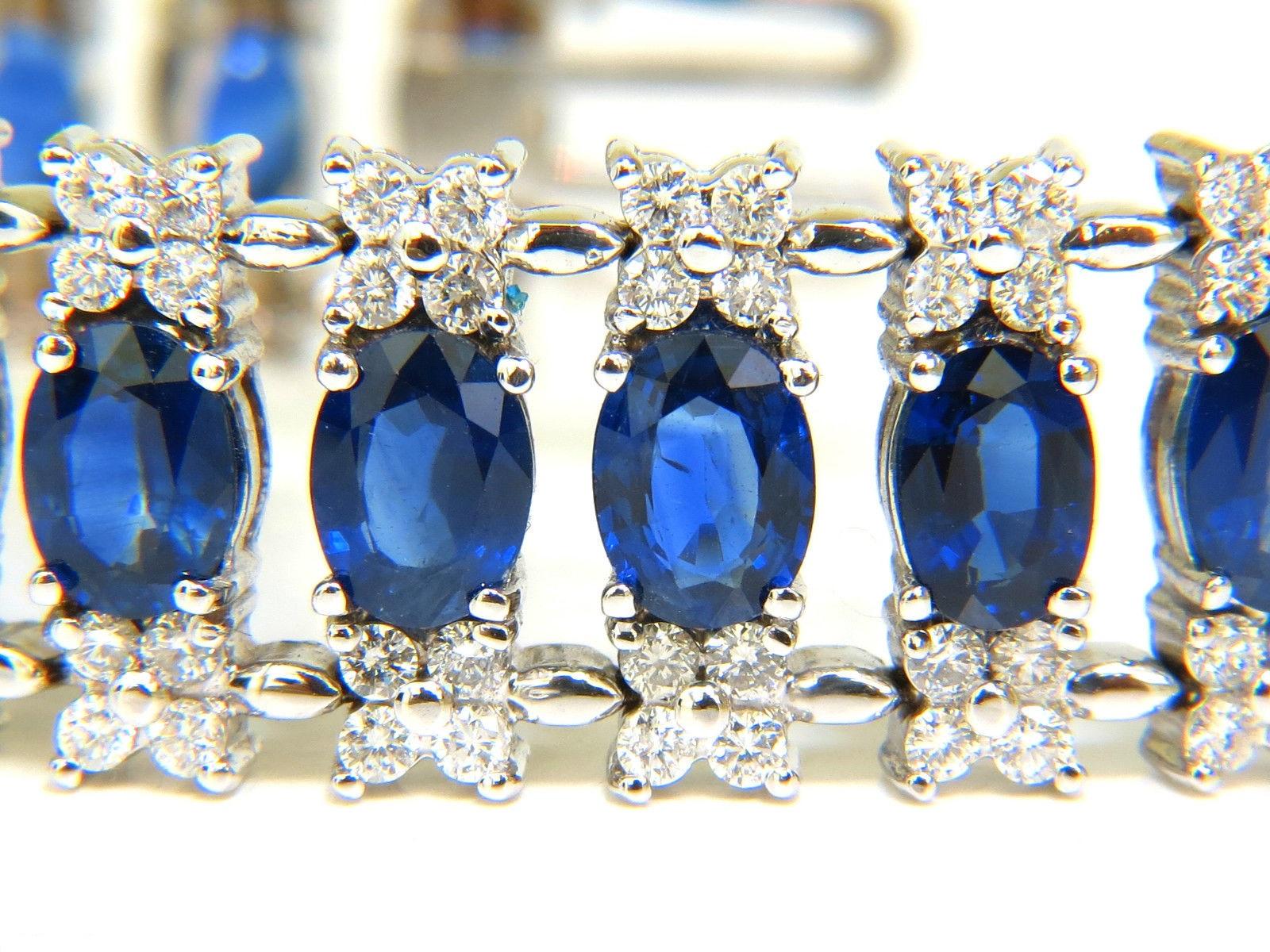 Stunning & Rare 

28.00ct. Natural Sapphires 

vivid royal blue

transparent and full cut ovals

clean clarity



 5.75ct. Diamonds 

Brilliant Cuts.

G-color, Vs-2 clarity

14kt. White gold 

42.9 grams.

7 inches long 

15.6mm wide

Secure locking