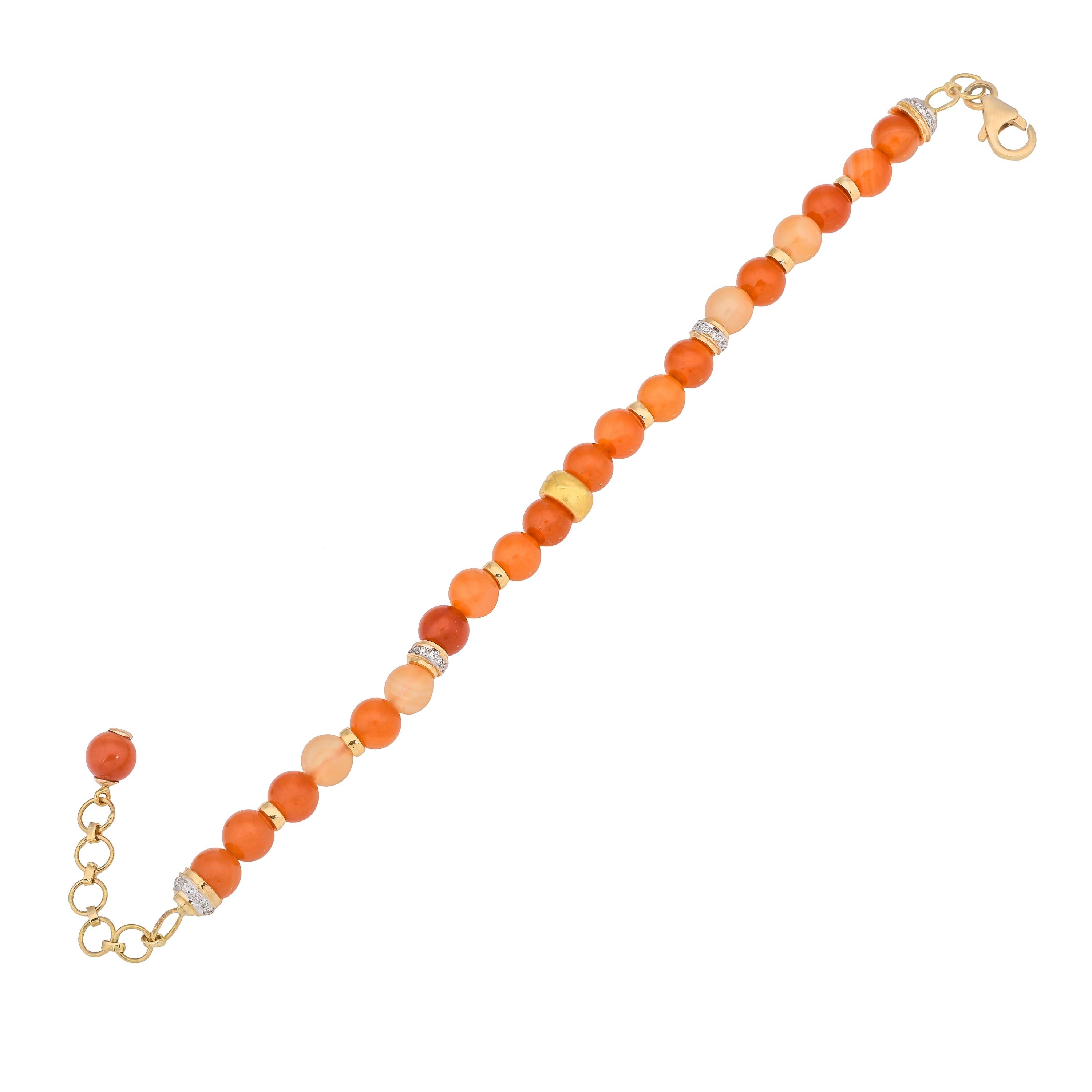 Bursting in a melange of colors as vibrant as the hues of galaxies by getting your hands on these luxurious customizable gemstone bracelet, handcrafted from carnelian balls weighing approximately 33.76 carats and further strung together with gold