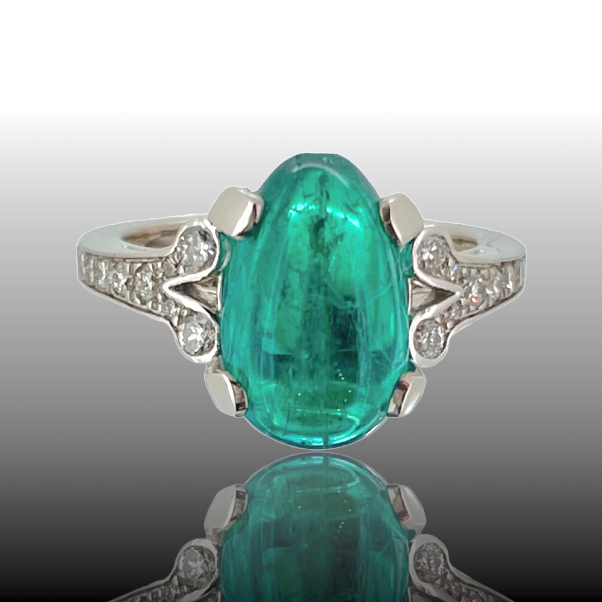 This beautiful ring is adorned with a 3.37ct Emerald from Colombia. It comes with a certificate from MGL. The ring is shouldered with brilliant cut diamonds and it is in excellent condition. The ring is made in platinum and it is marked with the