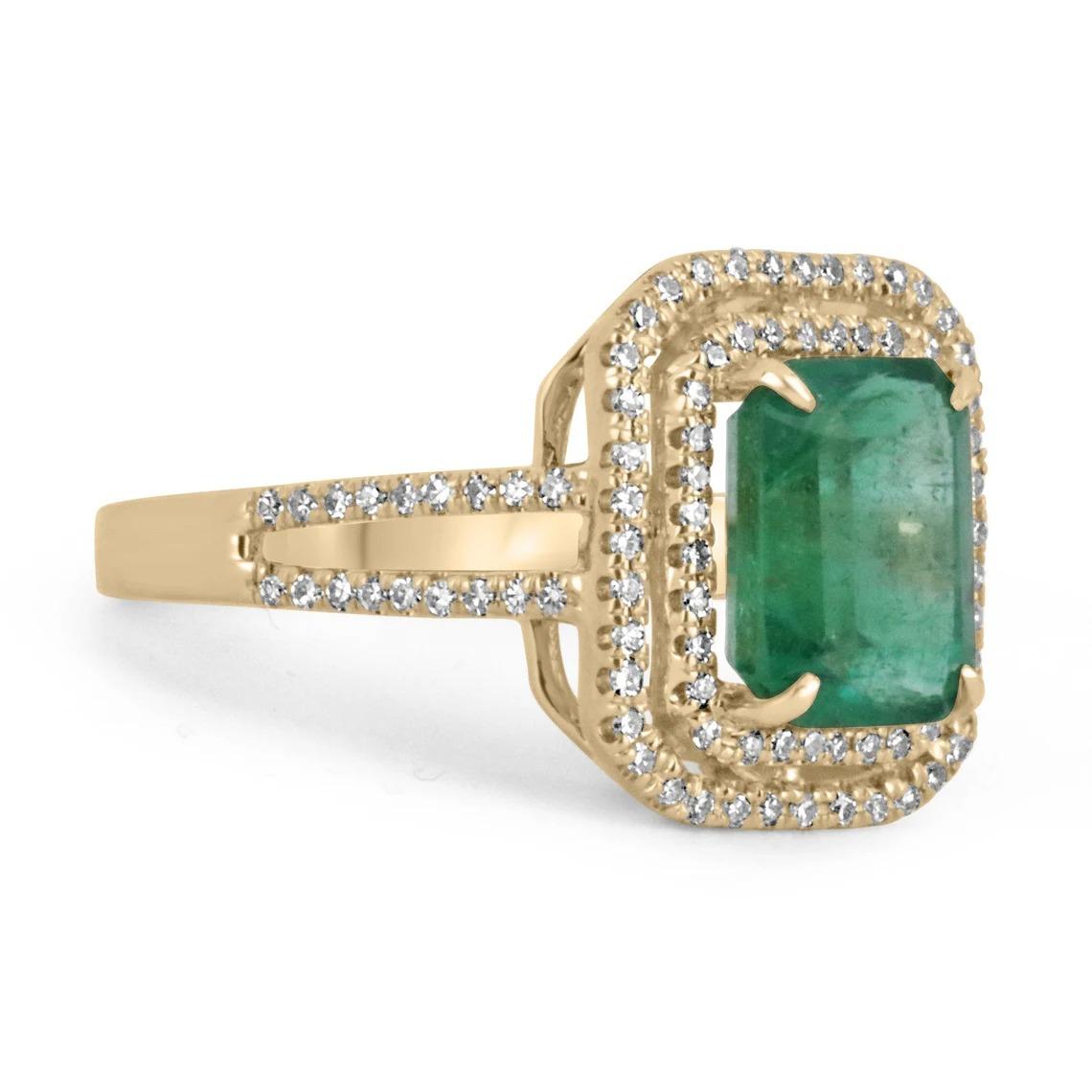 Featured is a stunning emerald and diamond ring. The center gemstone showcases a beautiful 2.92-carat, natural emerald cut emerald from the origin of Zambia. Displaying a gorgeous and lush dark green color, with a yellow hue to it. Surrounding this