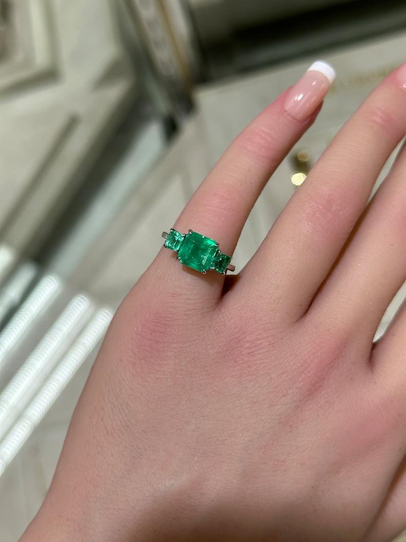 Contemporary 3.37tcw 18K Emerald Trilogy Ring: Asscher Cut Engagement & Right Hand Ring For Sale