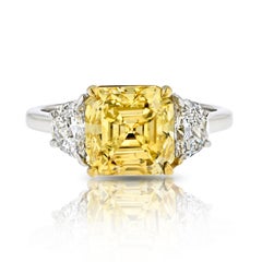 3.38-carat Fancy Vivid Yellow Asscher Cut Three Stone Diamond Engagement Ring