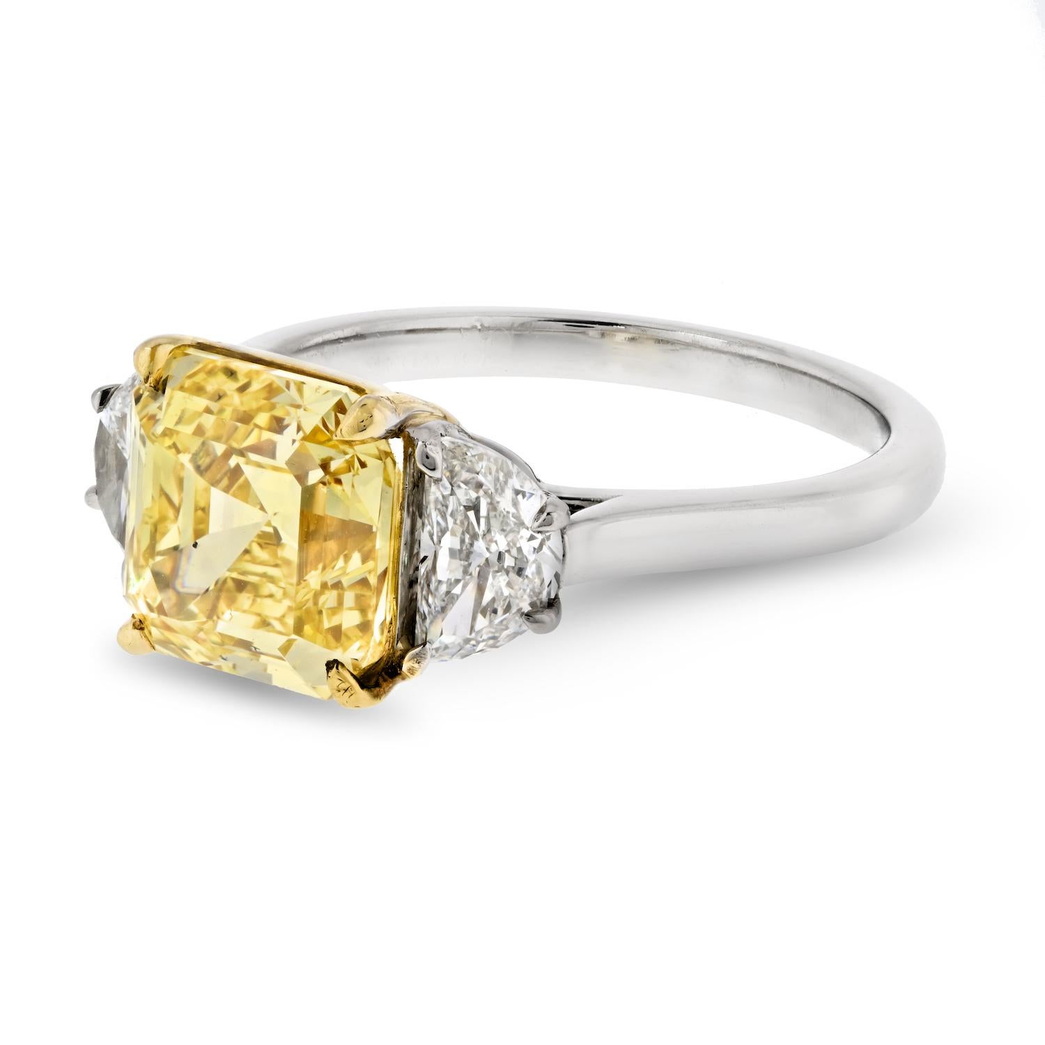 Modern 3.38-carat Fancy Vivid Yellow Asscher Cut Three Stone Diamond Engagement Ring For Sale