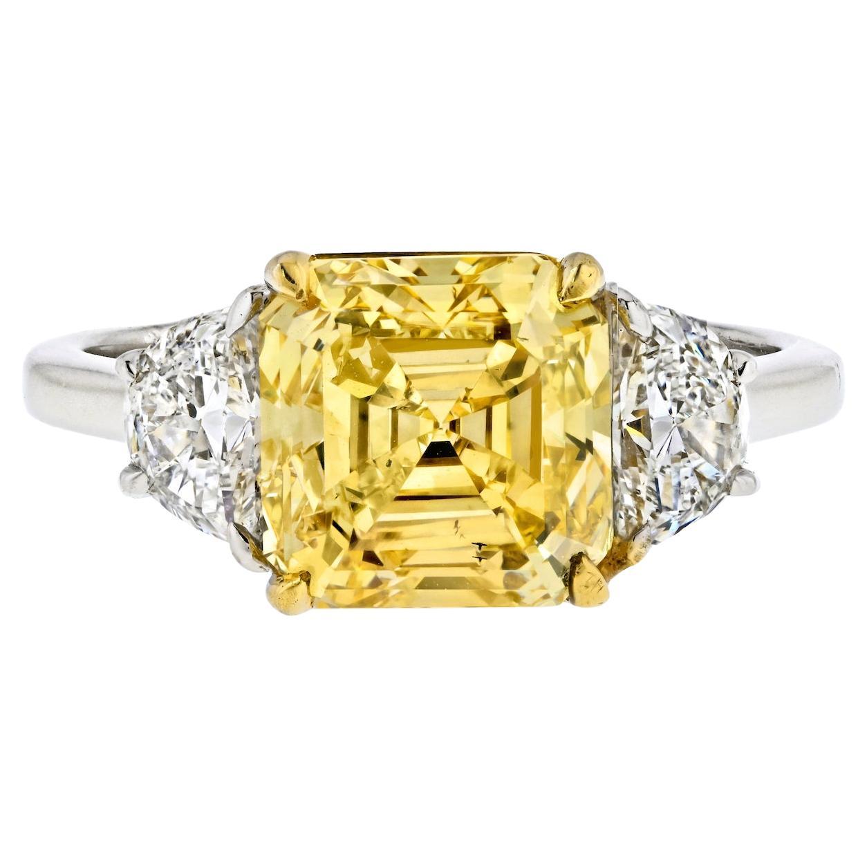 3.38-carat Fancy Vivid Yellow Asscher Cut Three Stone Diamond Engagement Ring For Sale
