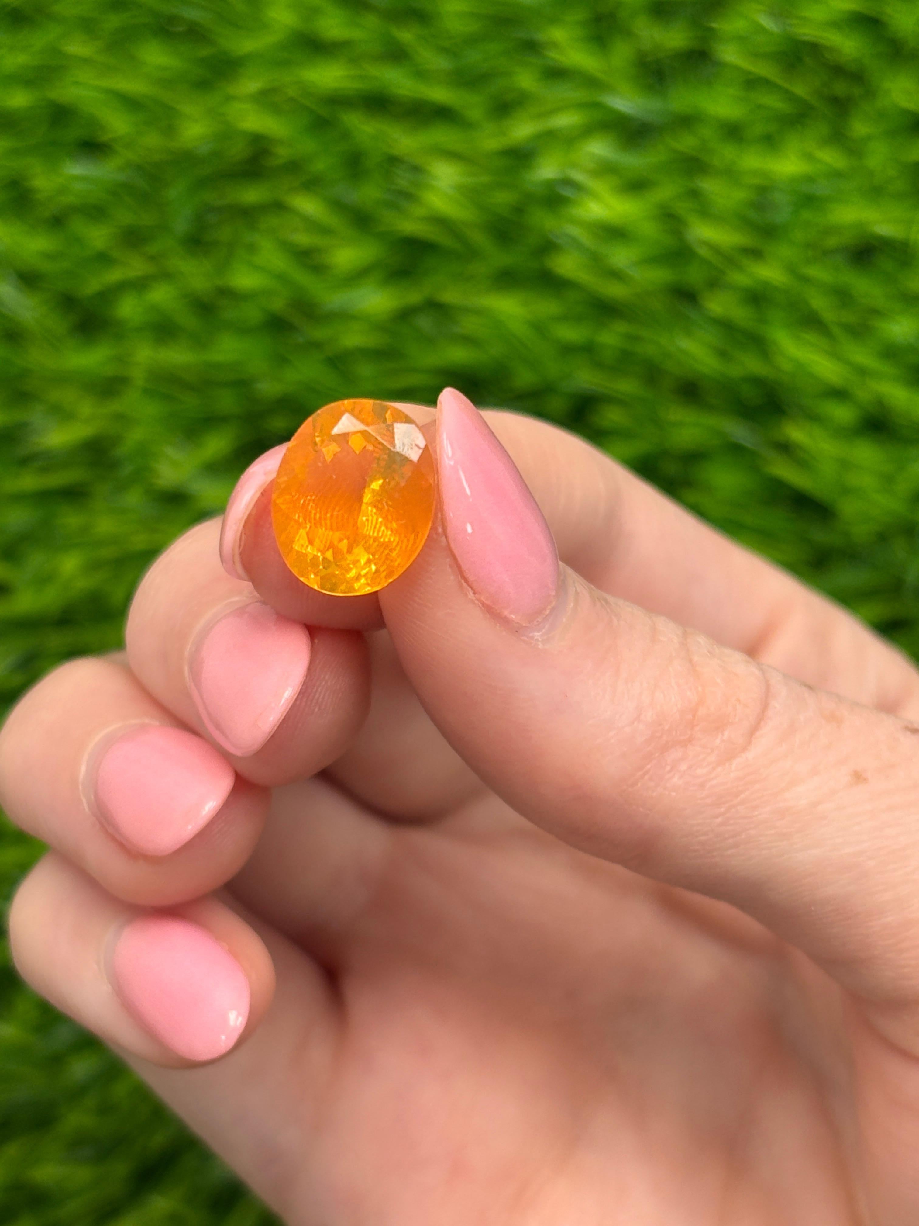 Contemporary 3.38 Carat Oval-Cut Natural Golden Orange Fire Opal Loose Gemstone For Sale
