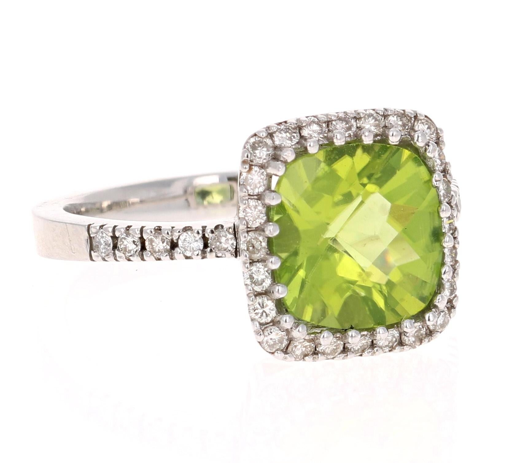 3.38 Carat Peridot Diamond Engagement White Gold Ring - this can be a stunning and unique alternative to an engagement ring!

This beautiful ring has a Cushion Cut Peridot in the center that weighs 2.97 carats. The ring is surrounded by a gorgeous
