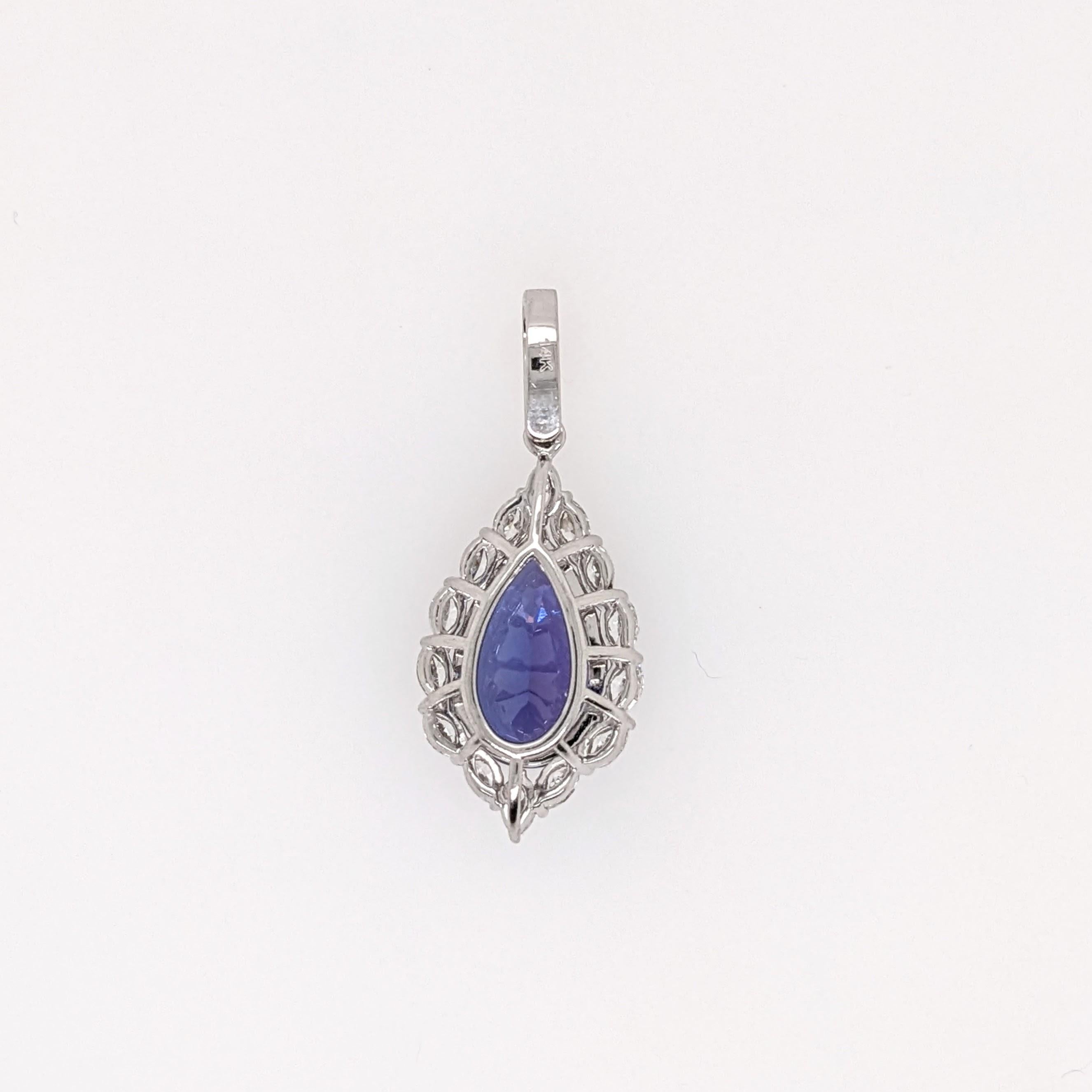 This deluxe tanzanite is absolutely gorgeous with a rich blue color and beautiful clean oval cut. We set it in a new NNJ pendant design (that reminds us a little of a pineapple!) made in 14k solid white gold and studded with all natural diamonds. A