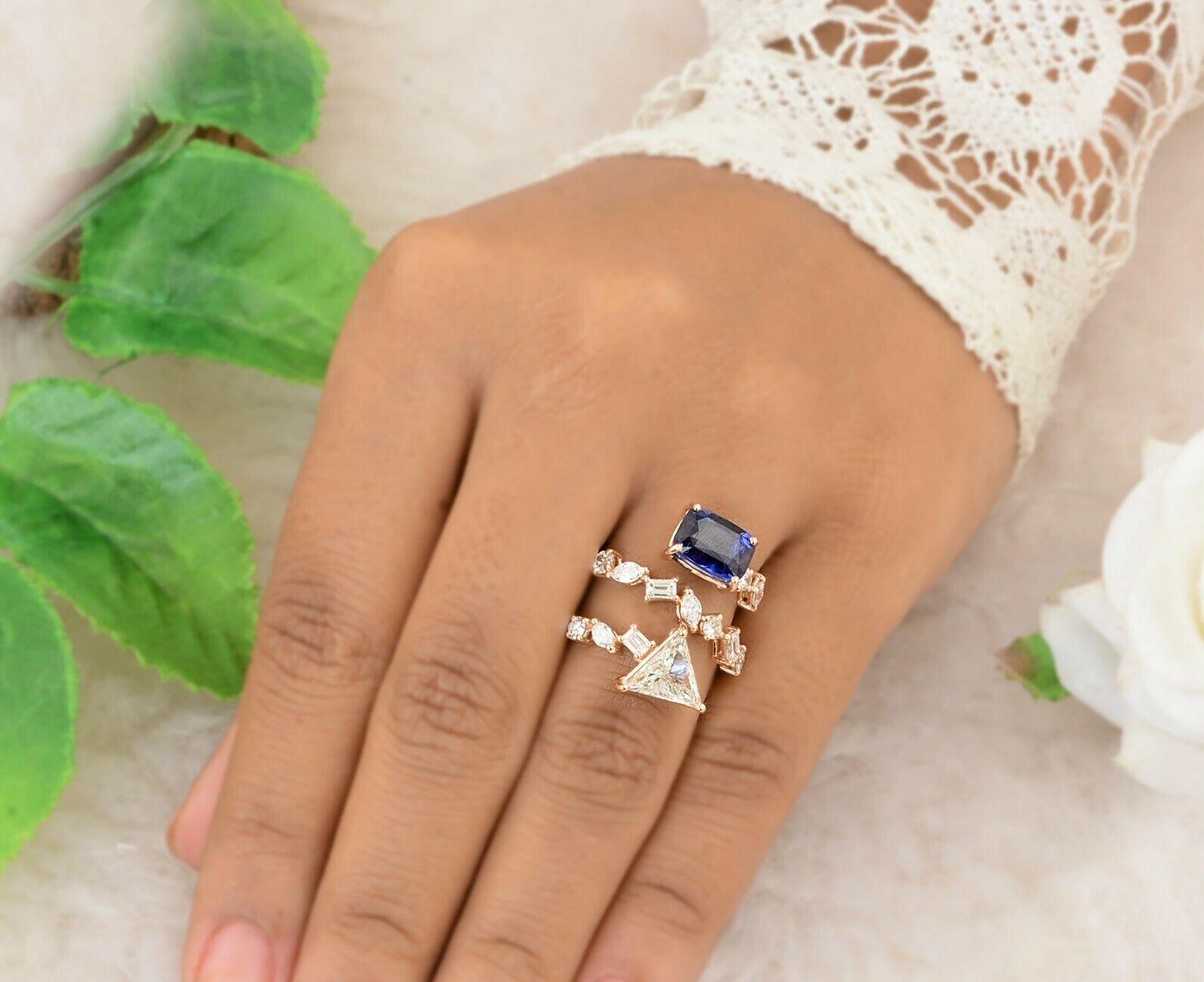 This ring has been meticulously crafted from 14-karat gold.  It is hand set with 3.39 carat blue sapphire & 2.15 carats of sparkling diamonds. 

The ring is a size 7 and may be resized to larger or smaller upon request. 
FOLLOW  MEGHNA JEWELS