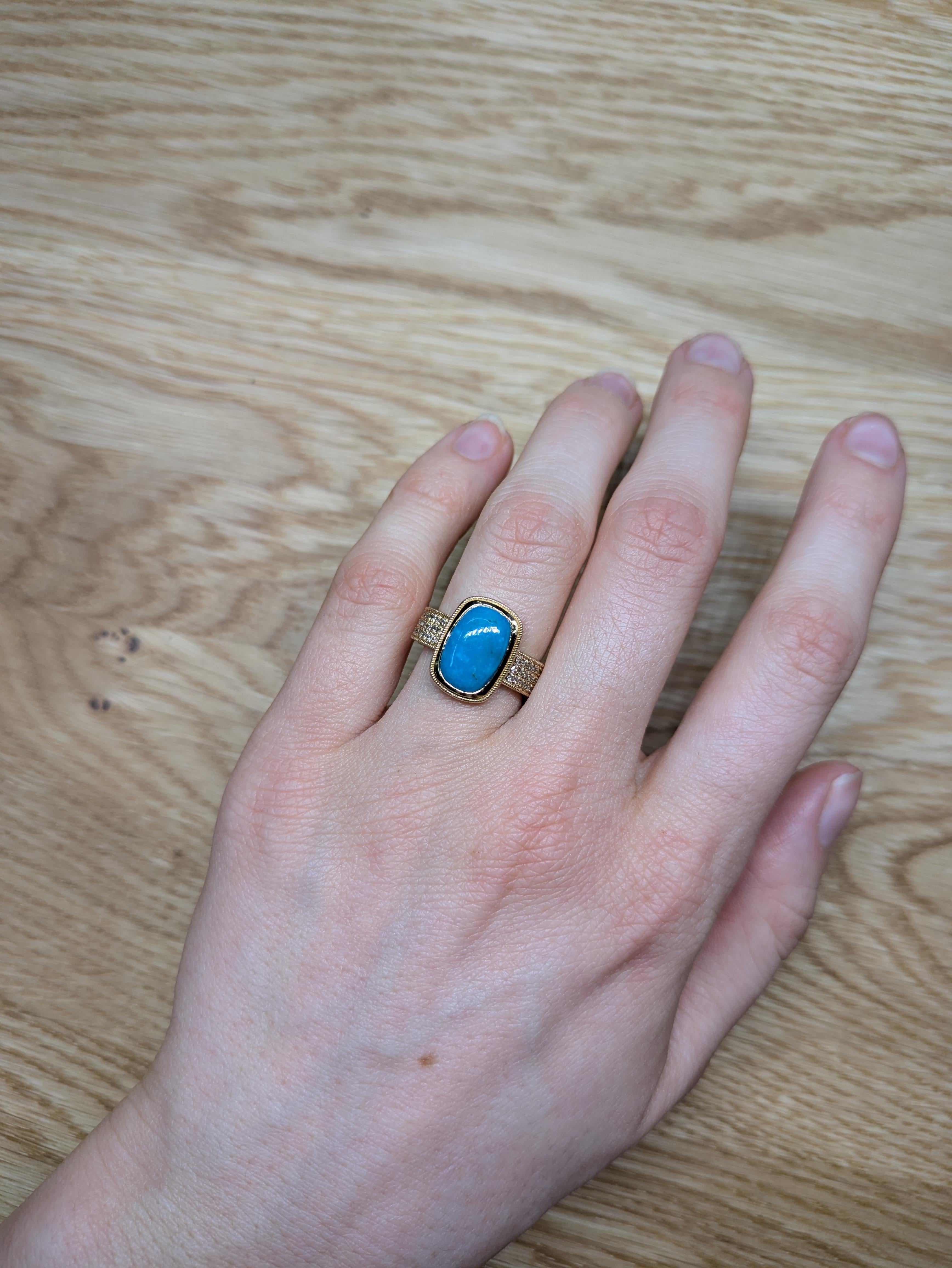 This beautiful ring features a 3.32 carat cushion cut Sonoran Turquoise gemstone with natural earth mined diamonds and a broad pave band set in solid 14K gold. This Sonoran Turquoise ring makes a lovely December birthstone gift for your loved ones!
