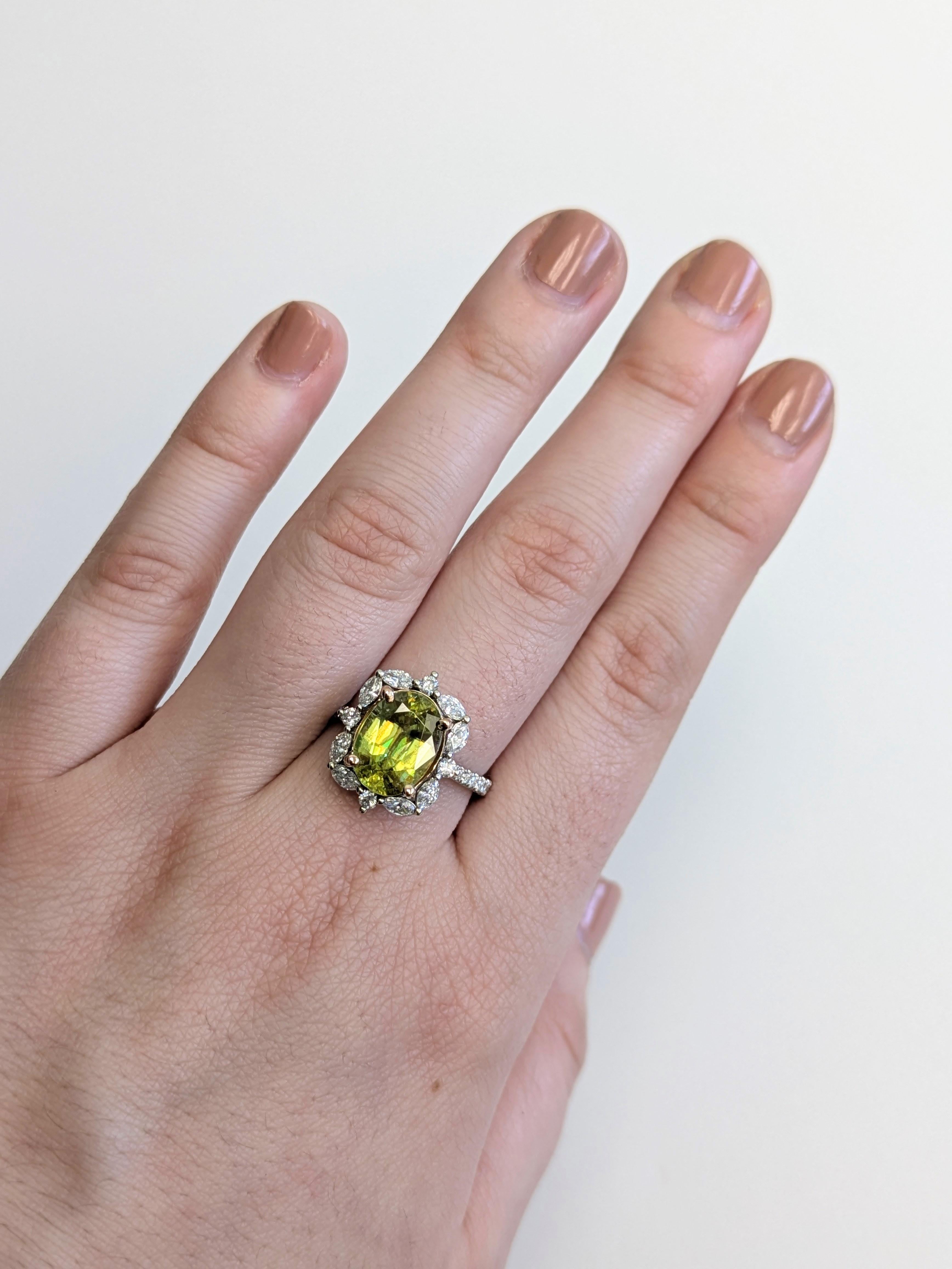 Make a bold impression with this 3.3 carat sphene statement ring, glowing with fiery brilliance. Set in solid 14K real gold, it features earth-mined diamond accents in marquise and round cuts for an elegant, one-of-a-kind look.

**We offer