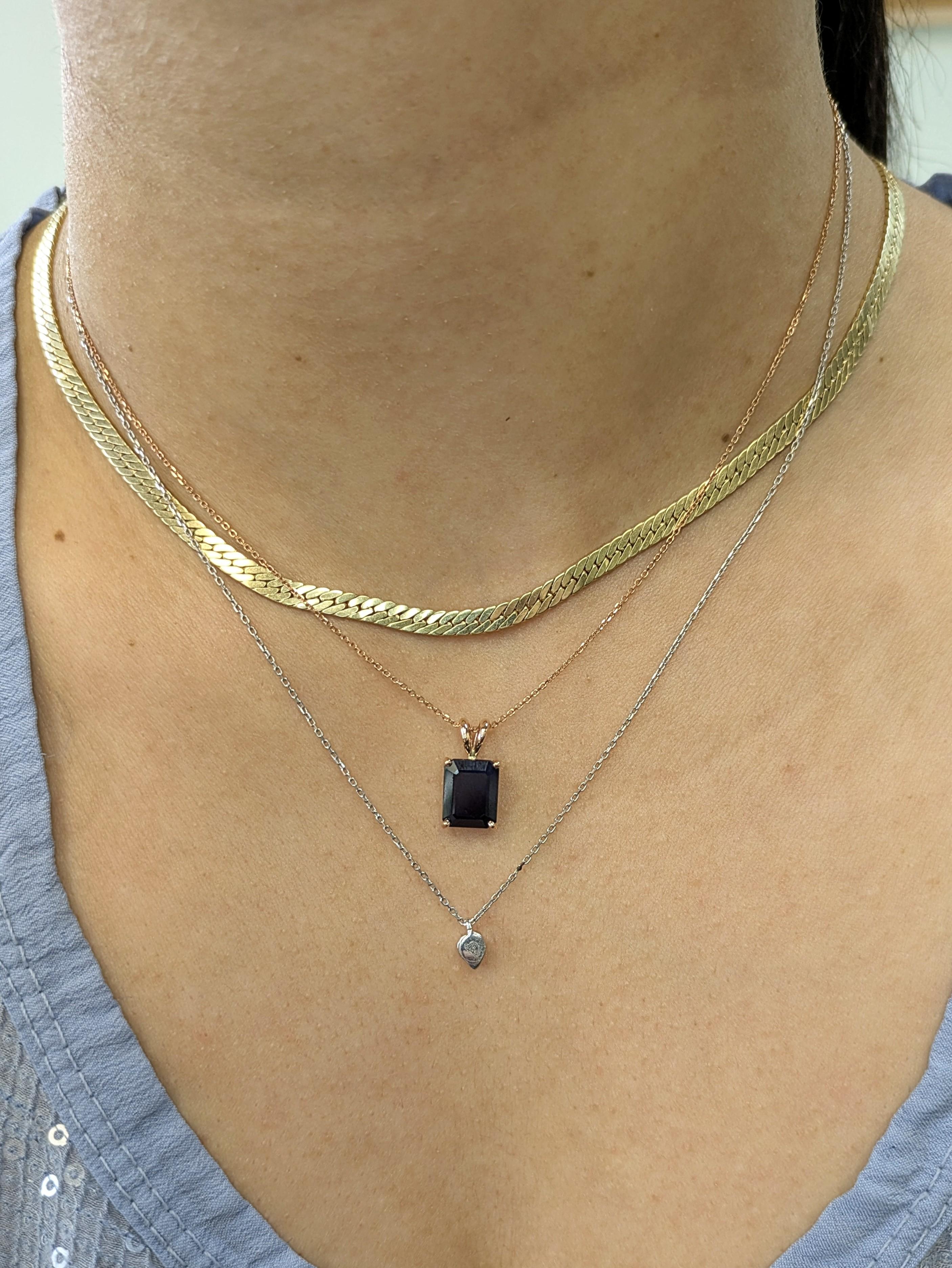 Bold, brilliant, and a little bit bunny. This 3.32-carat midnight blue sapphire pendant brings serious wow-factor with its rich depth and unique rose gold setting. Topped with a rabbit bail for an unexpected twist—because classic doesn’t have to