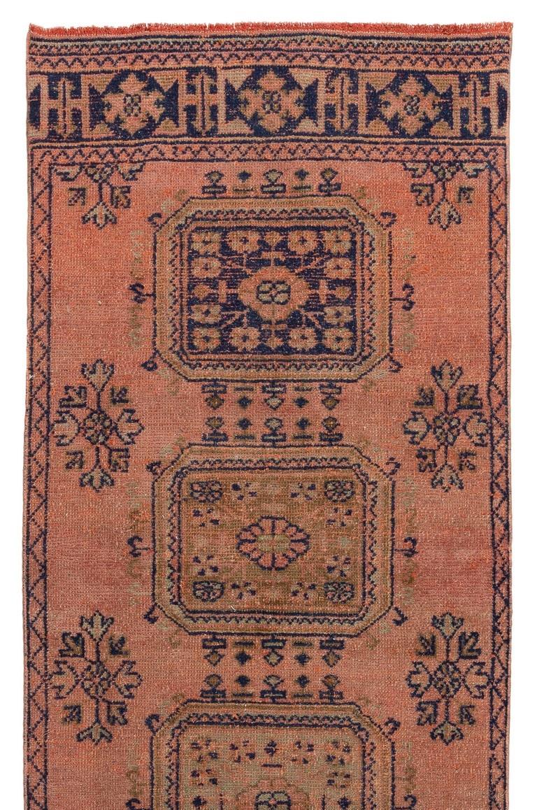 One of a pair of vintage Turkish Oushak runners. Finely hand-knotted with even medium wool pile on wool foundation. Very good condition. Sturdy and as clean as a brand new rug (deep washed professionally). Measures: 3.3 x 10.5 ft.
