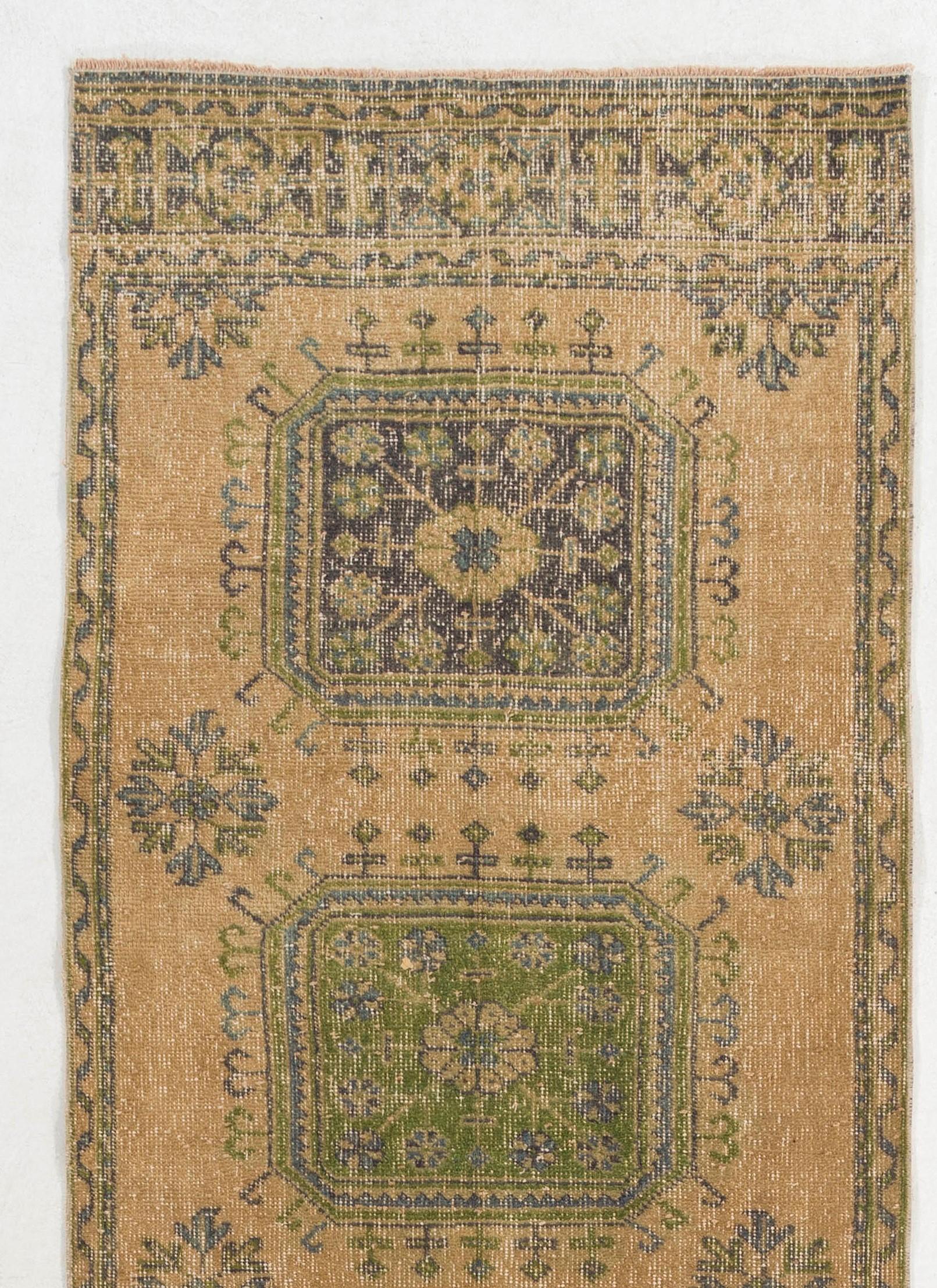A vintage runner rug from Central Turkey. Finely hand-knotted with even medium wool pile on cotton foundation. Very good condition. Sturdy and as clean as a brand new rug (deep washed professionally)