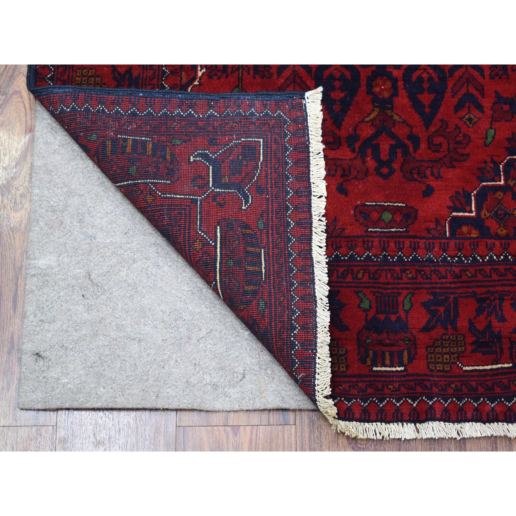 This is a truly genuine one-of-a-kind Hand Knotted Afghan Khamyab Geometric Medallion Design Soft Vibrant Wool Deep and Saturated Red Oriental Rug. It has been Knotted for months and months in the centuries-old weaving craftsmanship techniques by