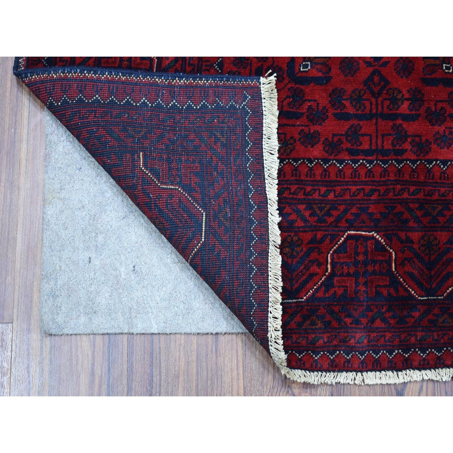 This is a truly genuine one-of-a-kind Deep and Saturated Red Geometric Design Afghan Khamyab Shiny Wool Hand Knotted Scatter Size Oriental Rug. It has been woven for months and months in the centuries-old Persian weaving craftsmanship techniques by