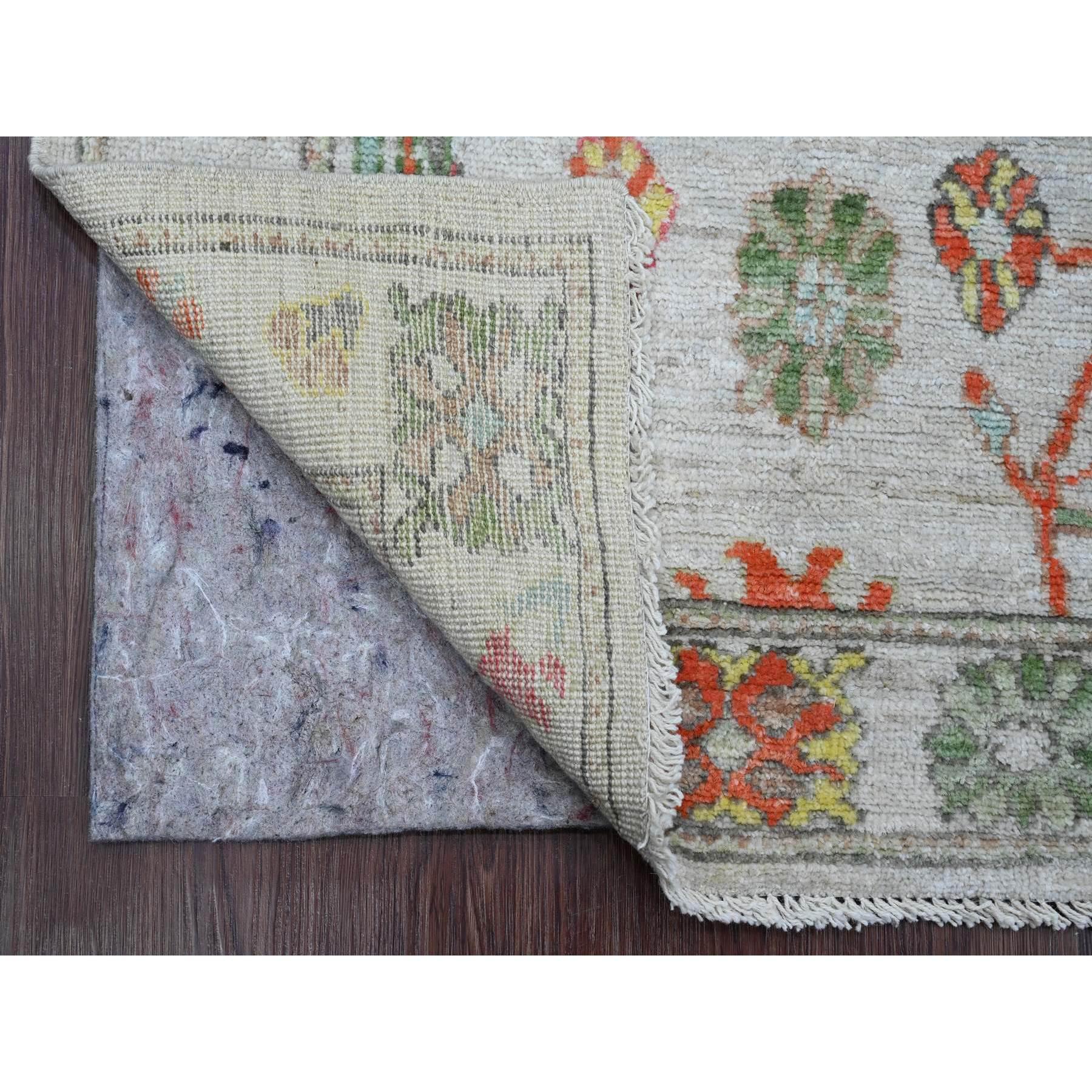 Chiffon White, Hand Knotted, Afghan Angora Oushak with Colorful Leaf Design, Vegetable Dyes, Pure Wool, Oriental Rug
Primary materials: Wool 
Latex: No Pile 
height: 0.25 Inches
Style: Transitional
Primary color: Ivory
Secondary colors: Red, Yellow,