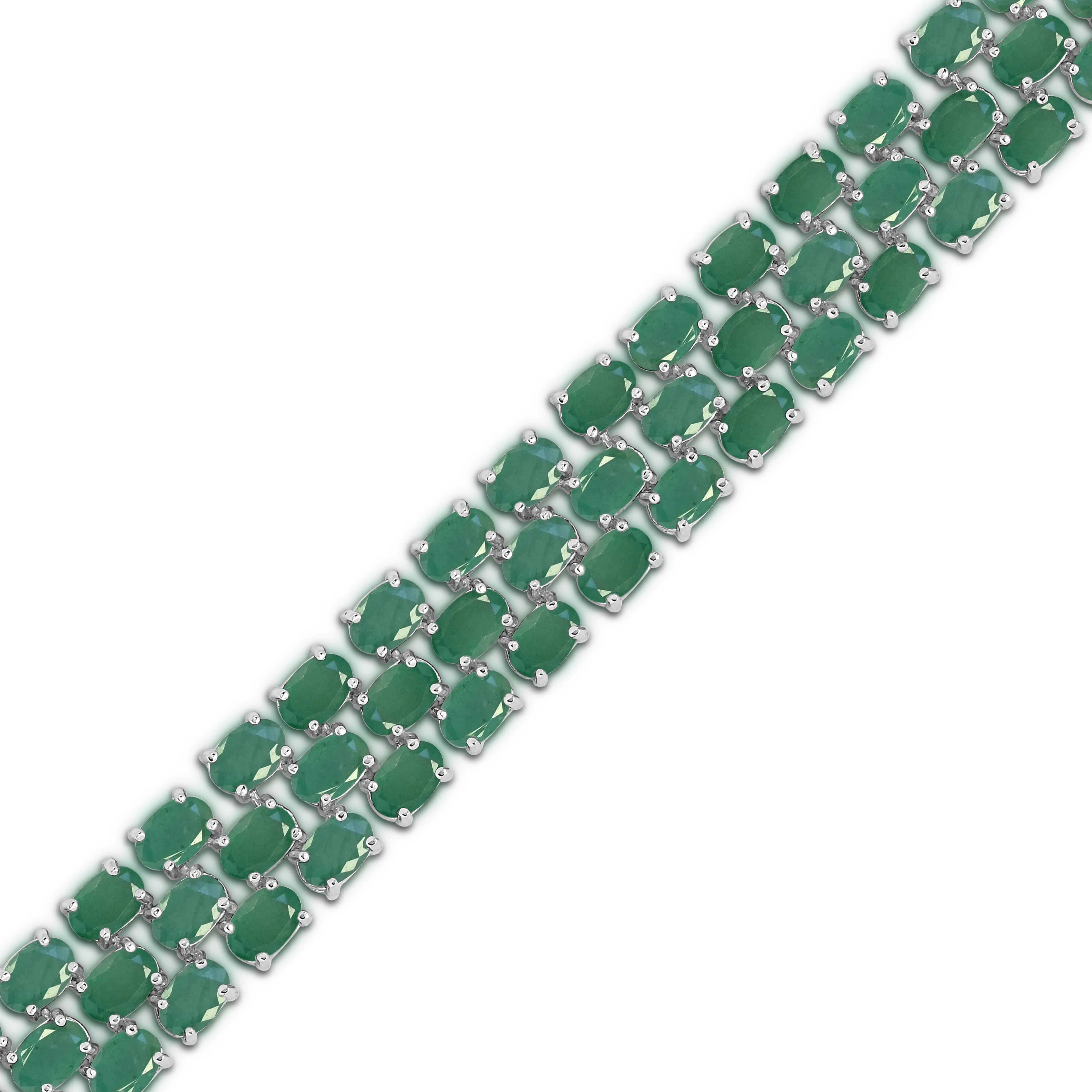 Indulge in the elegance of our 34-5/8 Carat Oval Emerald Creative Tennis Bracelet in Sterling Silver. Crafted with meticulous attention to detail, this bracelet boasts a stunning style of 77 oval emerald gemstones. The silver tone prong setting adds