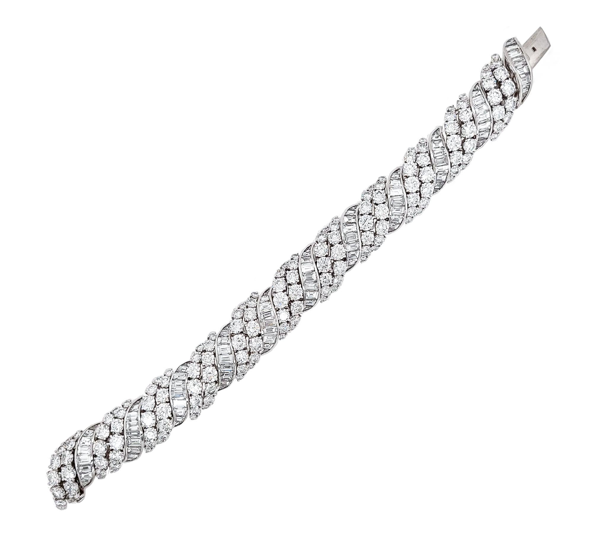 Like beautiful swells in the ocean, there is nothing quite so lovely as waves of diamonds, especially when they are encircling your wrist. This sparkling Contemporary Diamond Scroll Bombé Bracelet is crafted in platinum and features wide diagonal