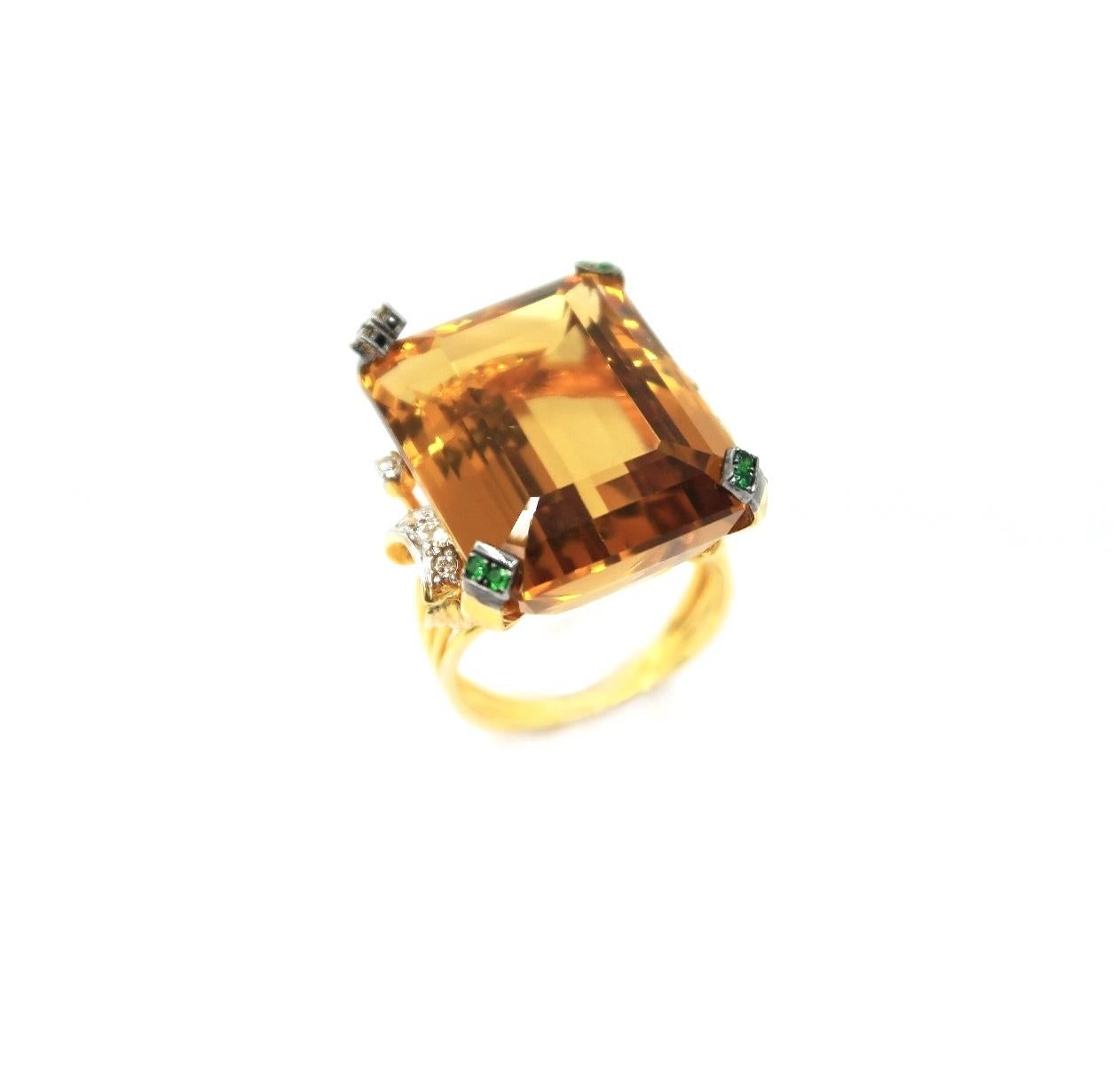 34 Carat Emerald Cut Citrine 18K Yellow Gold Ring with Tsavorite, Champagne and Diamond Ribbon Details

Please kindly let us know should you wish to have the ring resized.
Ring Size: US 6.5

Gold: 18K Yellow Gold, 6.82 g
Citrine: Emerald cut,