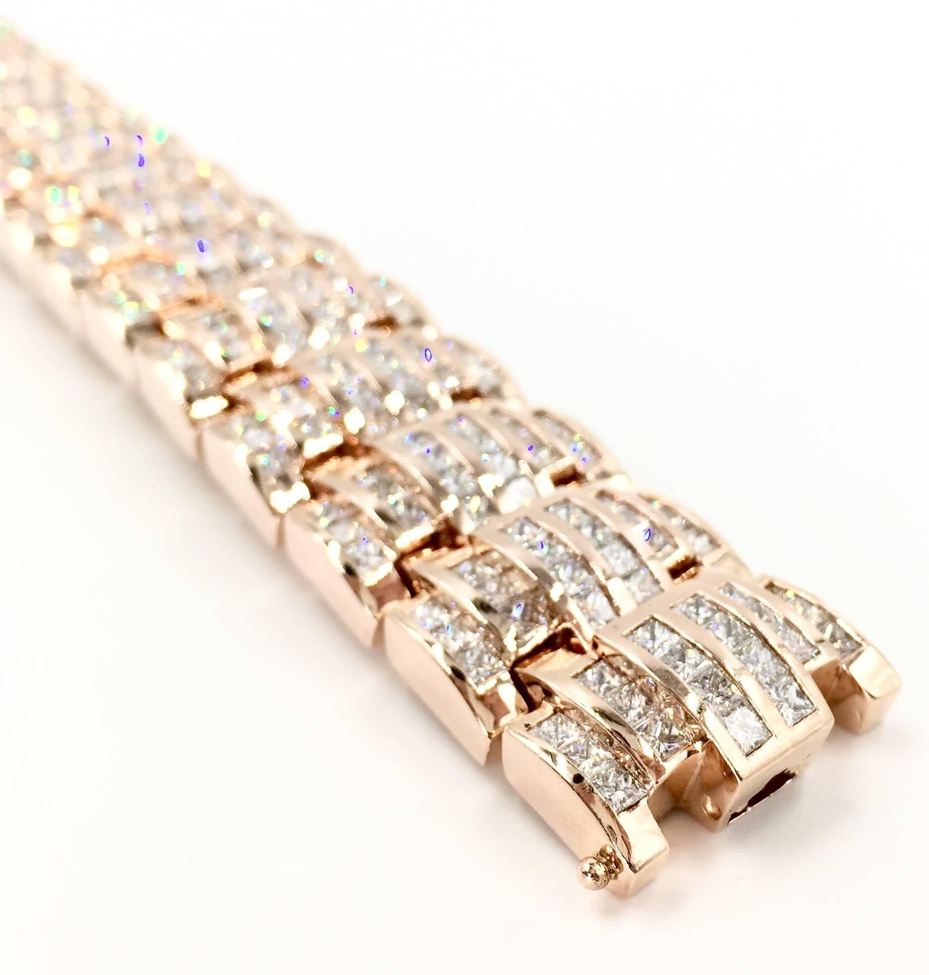 This 14K rose gold bracelet features beautifully channel-set princess-cut diamonds with a total weight of 34.00 carats. Designed by Quadamas, a jewelry manufacturer specializing in exquisite channel-set and invisibly-set jewelry. This is a statement
