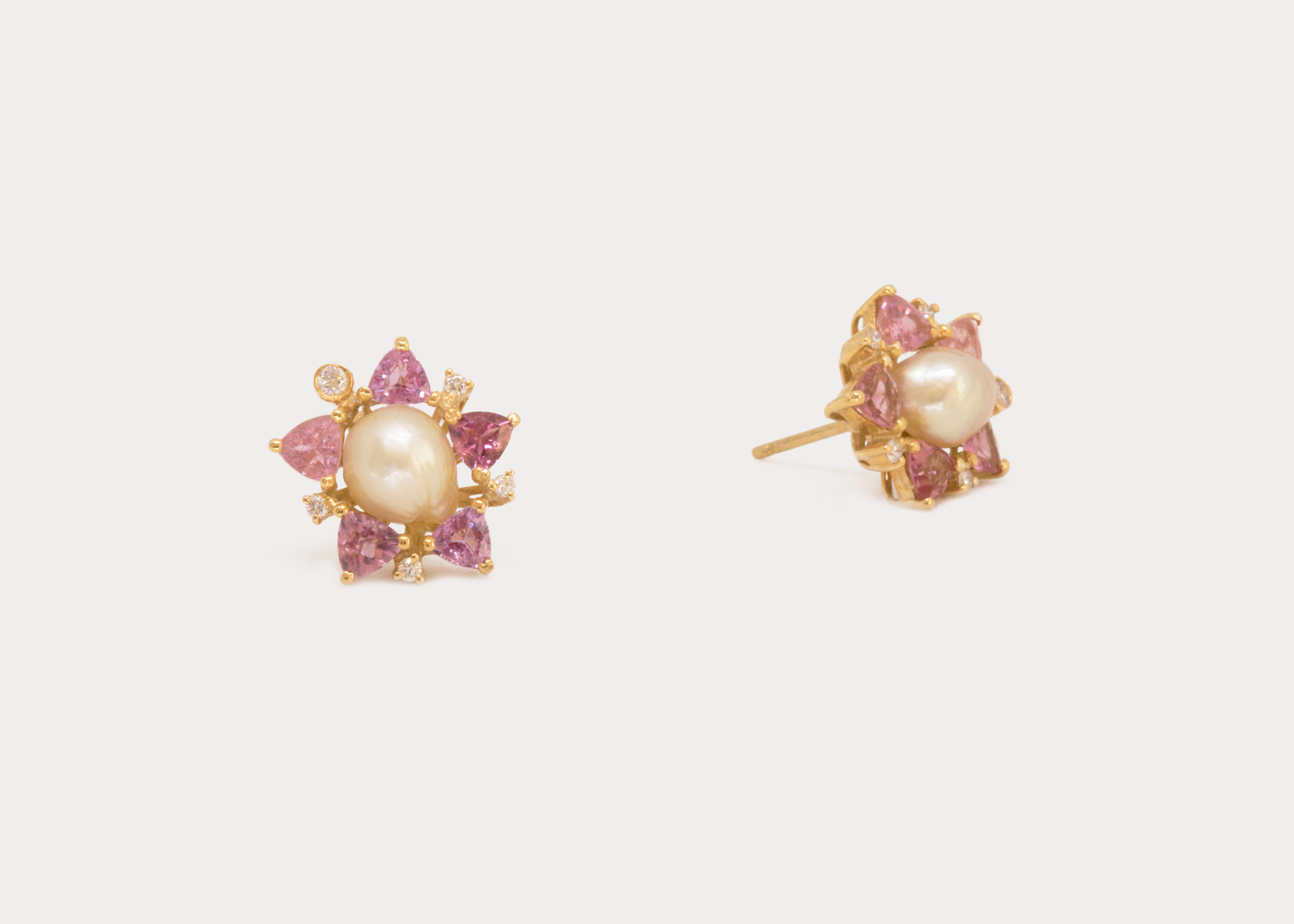 A collection of red and pink gem stones surround these irregularly shaped tourmaline stones.
The natural pearl studs may be detached and worn separately. 

*This piece is one of a kind.

Gold Weight: 19.8 g
Pearl Weight: 4.83 ct.
Tourmaline Weight: