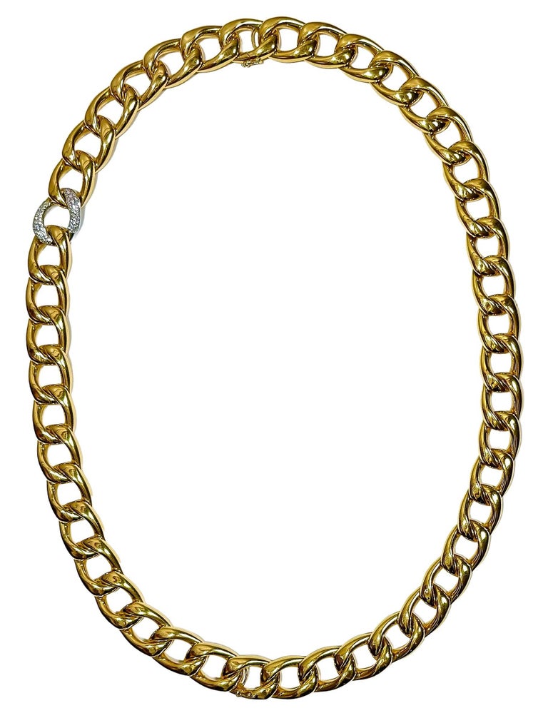 This magnificently crafted 18K yellow gold two piece necklace is comprised of one 18 inch length, connected by a hidden clasp, to one 16 inch choker. The choker has one white gold link that is pave set with assorted diamonds weighing an approximate