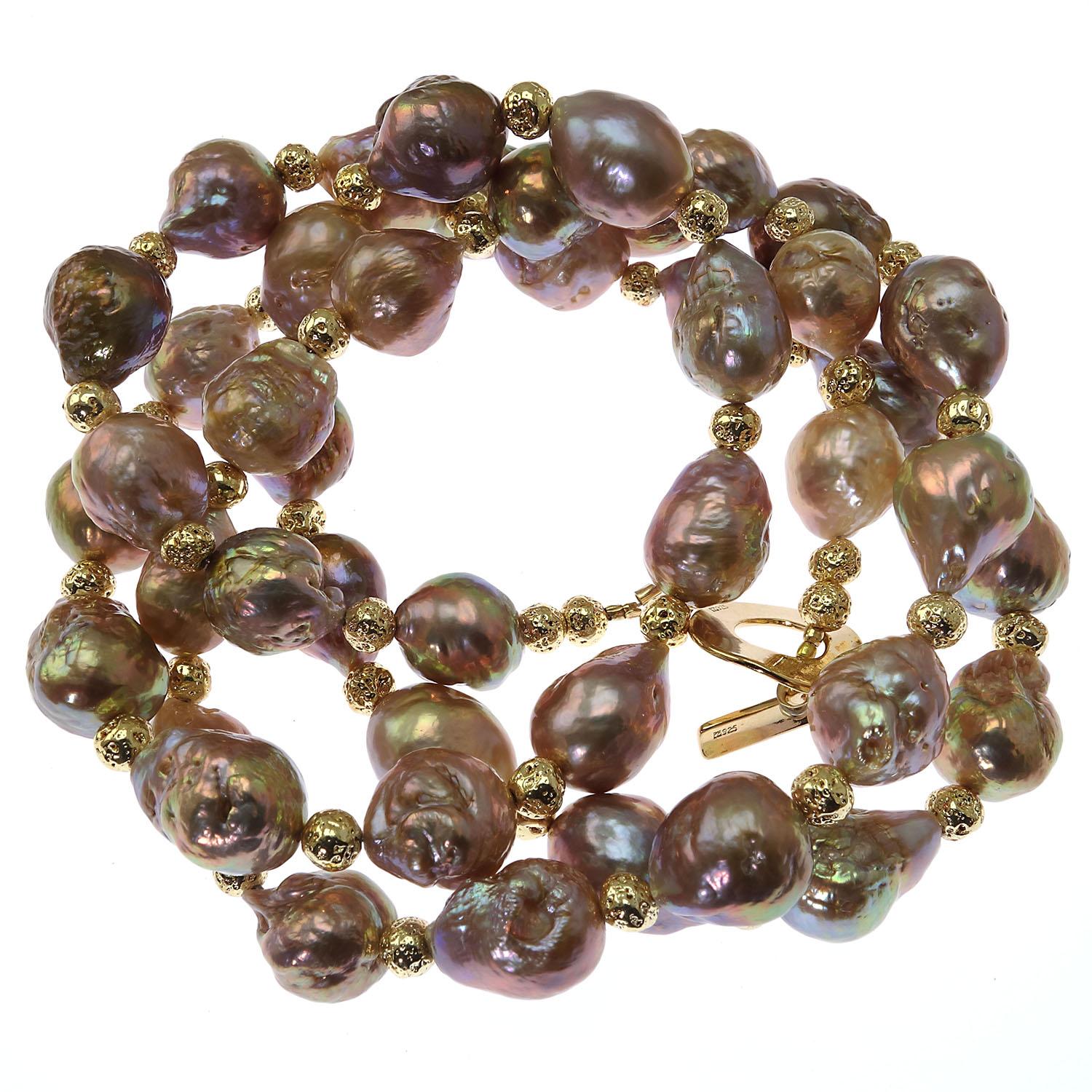 Custom made necklace of Natural Freshwater golden Pearls and goldy accents.  These unique pearls with their undertone of gold and mauve have flashes of pink and blue.  The gold accents enhance the natual rich gold of the pearls. This handmade