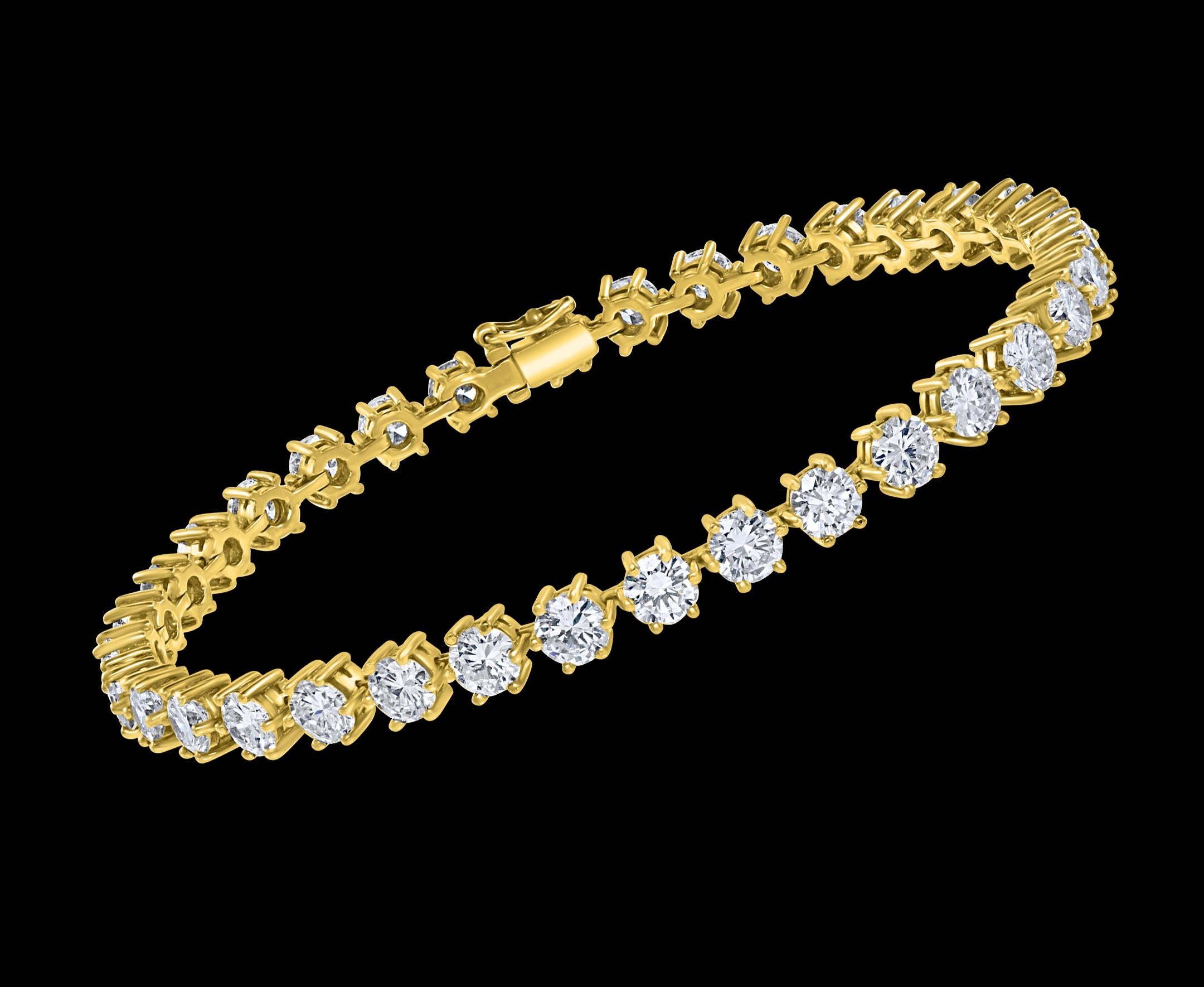 
34 Round Diamond 50 Pointer Each Tennis Bracelet in 18 K Yellow Gold 17 Ct Line Bracelet
Meet the ultimate bold tennis bracelet. The single row of prong set  Large Round Brilliant cut Diamonds.
50 pointer each , 34 Total pieces approximately 17