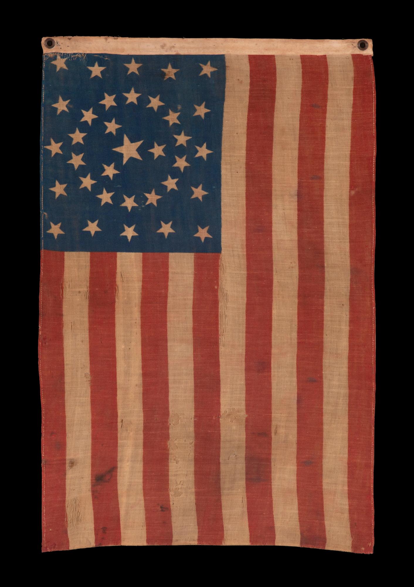 34 star antique american flag with an exceptionally rare circle-in-a-square configuration and a “y” formation of stars in the center, one of just three or four known examples in this style; opening two years of the civil war, 1861-1863, kansas