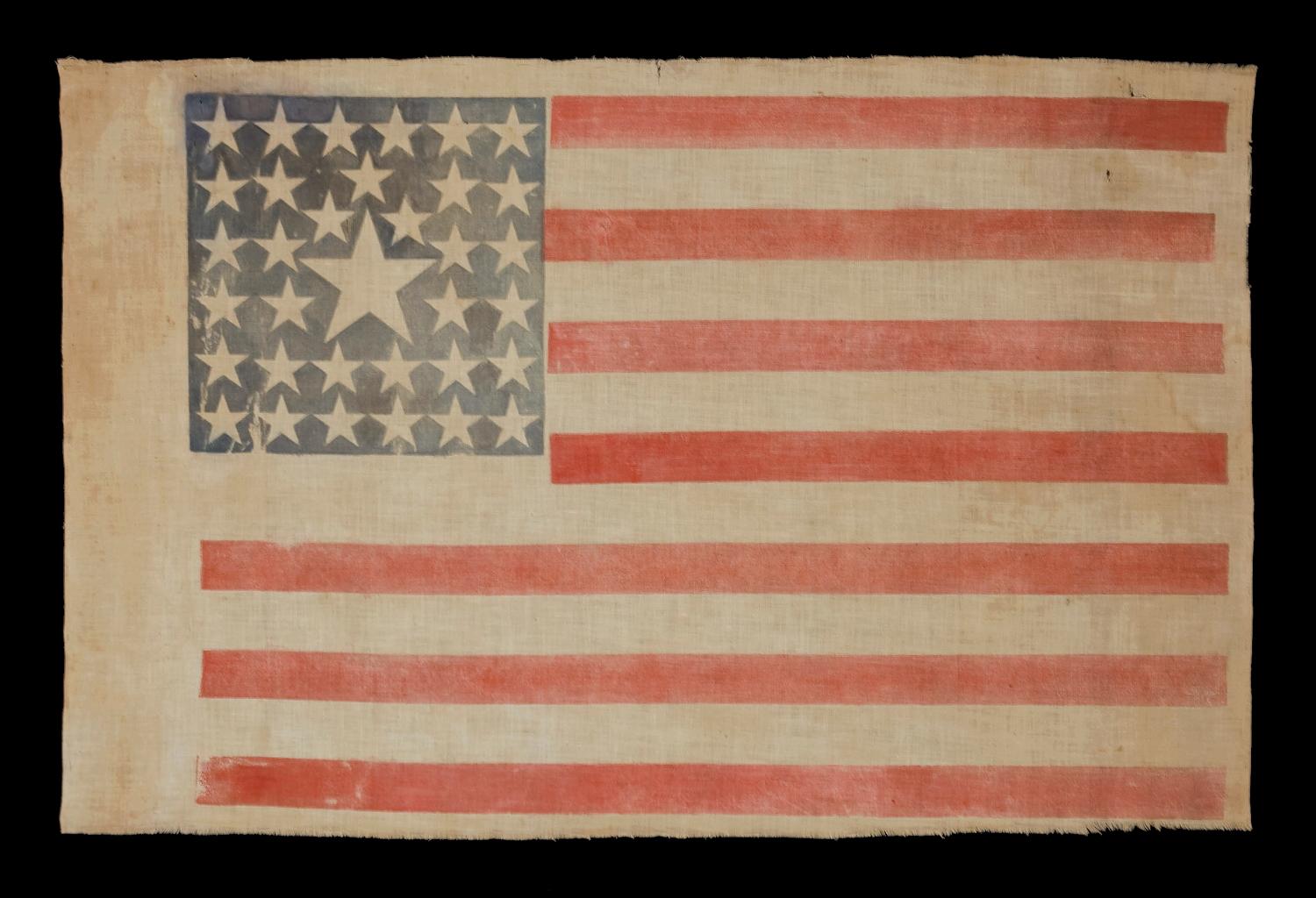 34 STARS IN A VERY RARE PATTERN THAT FEATURES A HUGE CENTER STAR IN THE MIDST OF A LINEAL STAR PATTERN, ONE-OF-A-KIND AMONG KNOWN EXAMPLES, CIVIL WAR PERIOD, 1861-63, KANSAS STATEHOOD


Early flags are collected for many reasons, but one of the