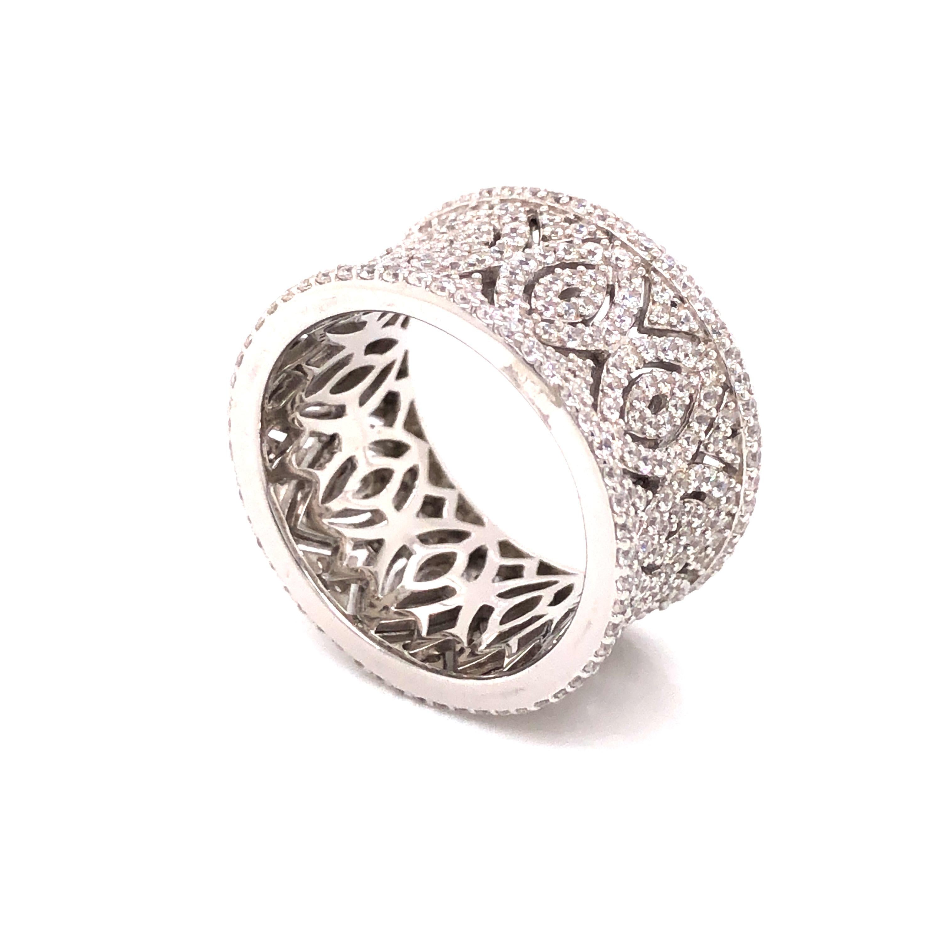 Mixing femininity and contemporary design, this intricate ring is sumptuous and exciting. 

Featuring 0.68 carat of pave set round brilliant cut cubic zirconia. 

Composed of 925 sterling silver with either a white rhodium finish, a 14ct rose gold